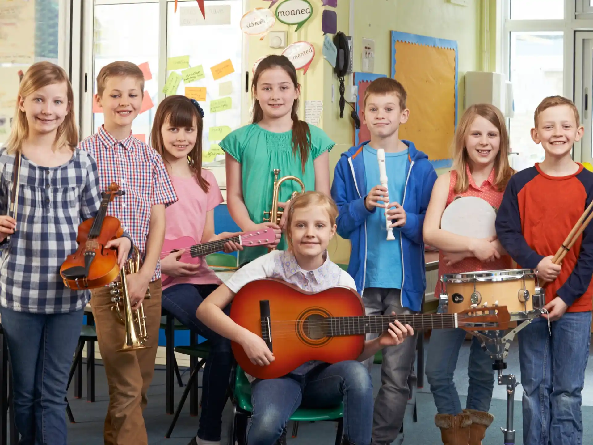 a group of people holding instruments