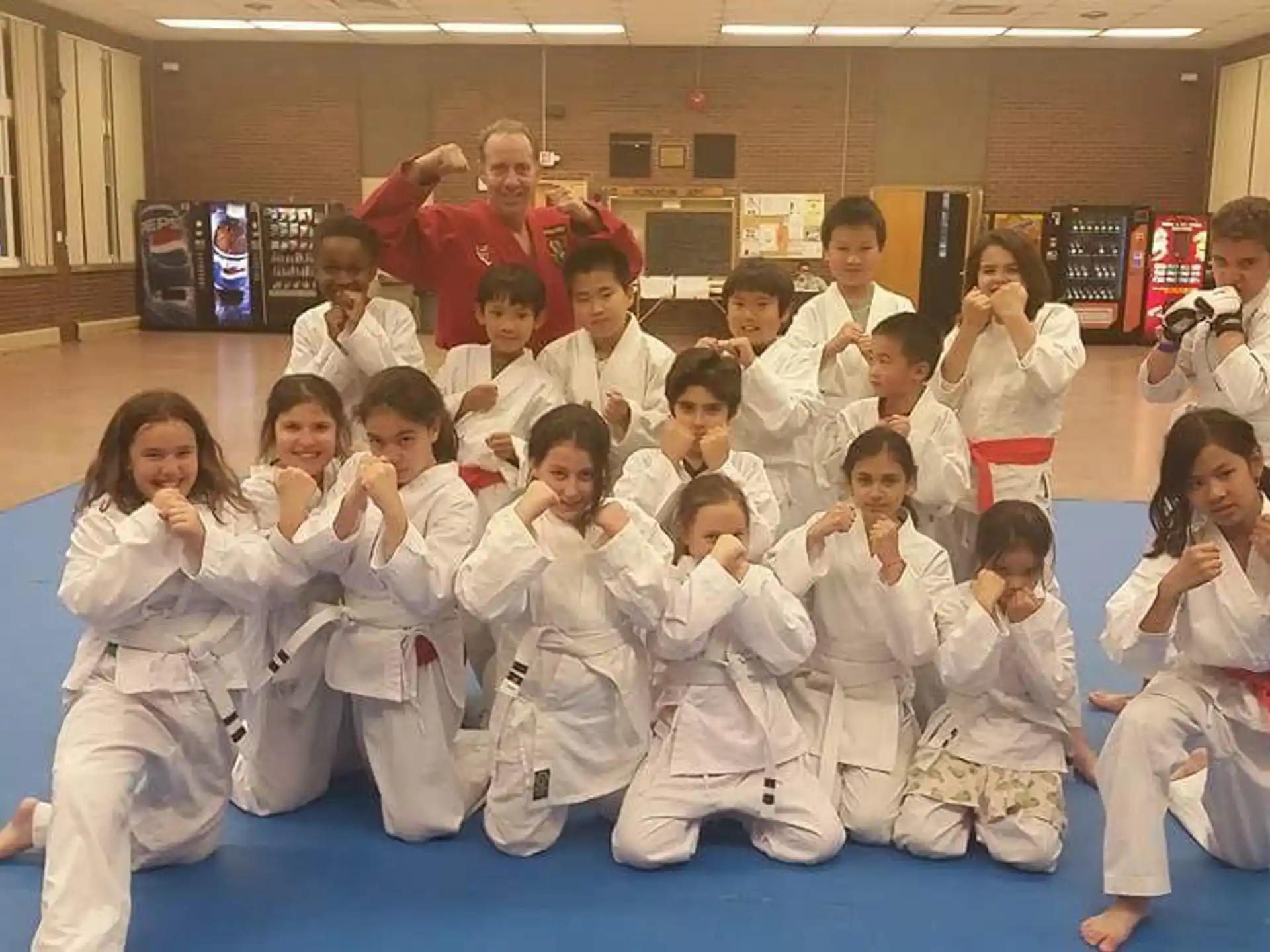 a group of people in karate uniforms