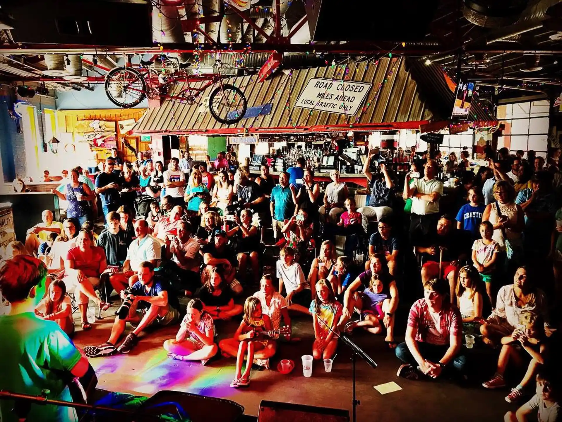 a group of people sitting on the floor