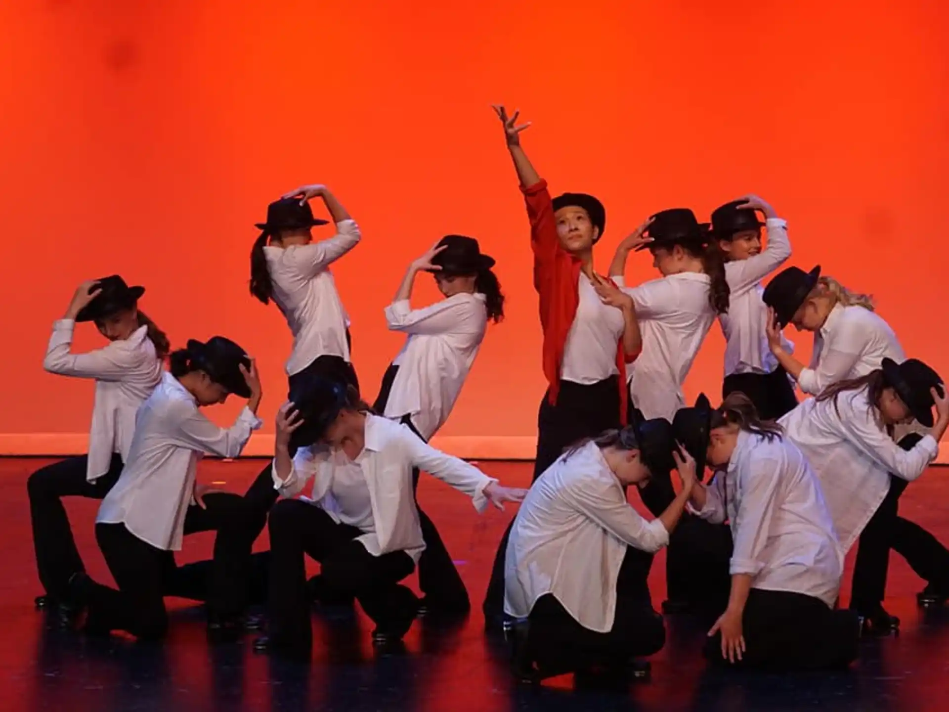 a group of people in white karate uniforms