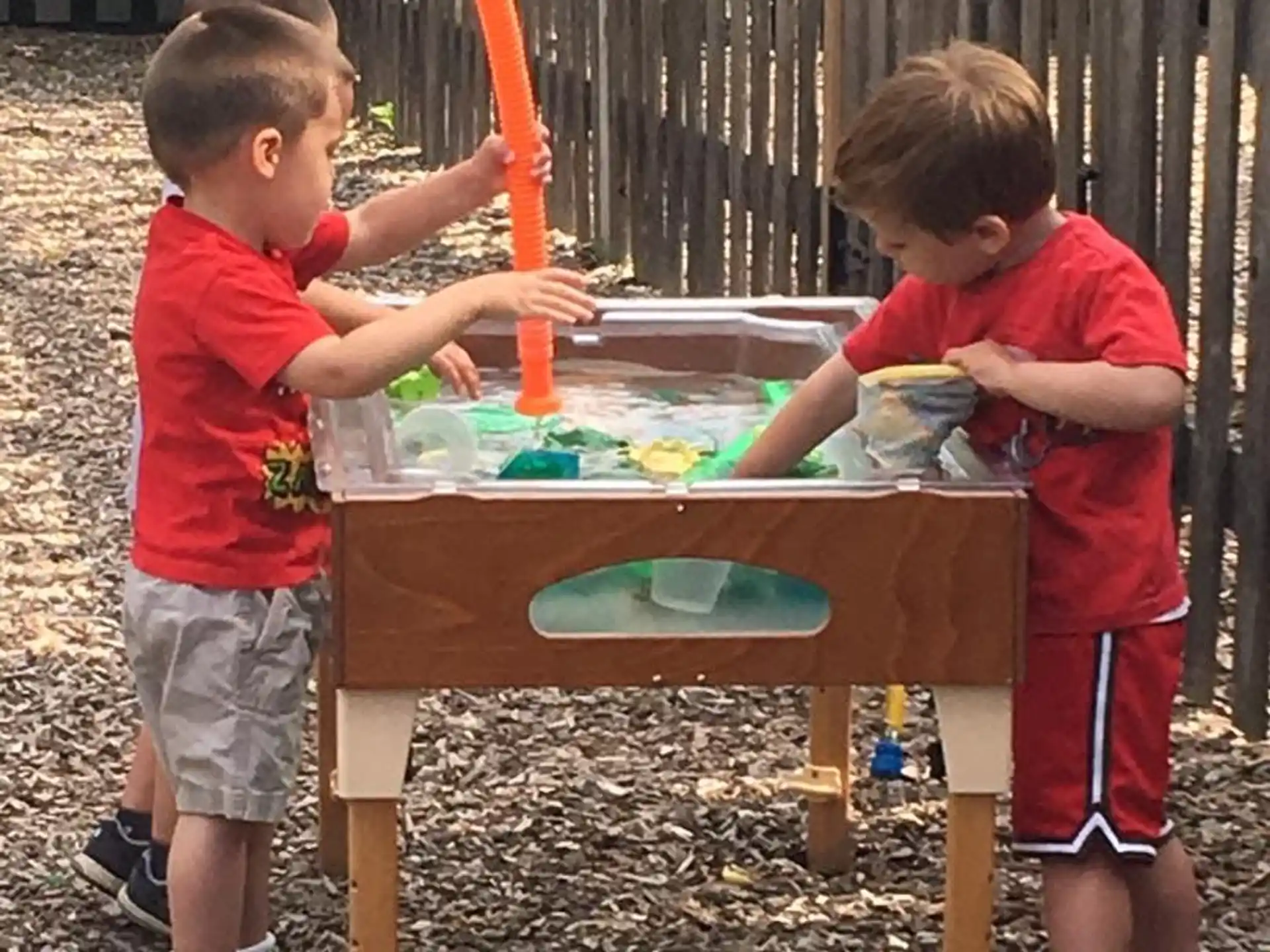two boys playing with a table