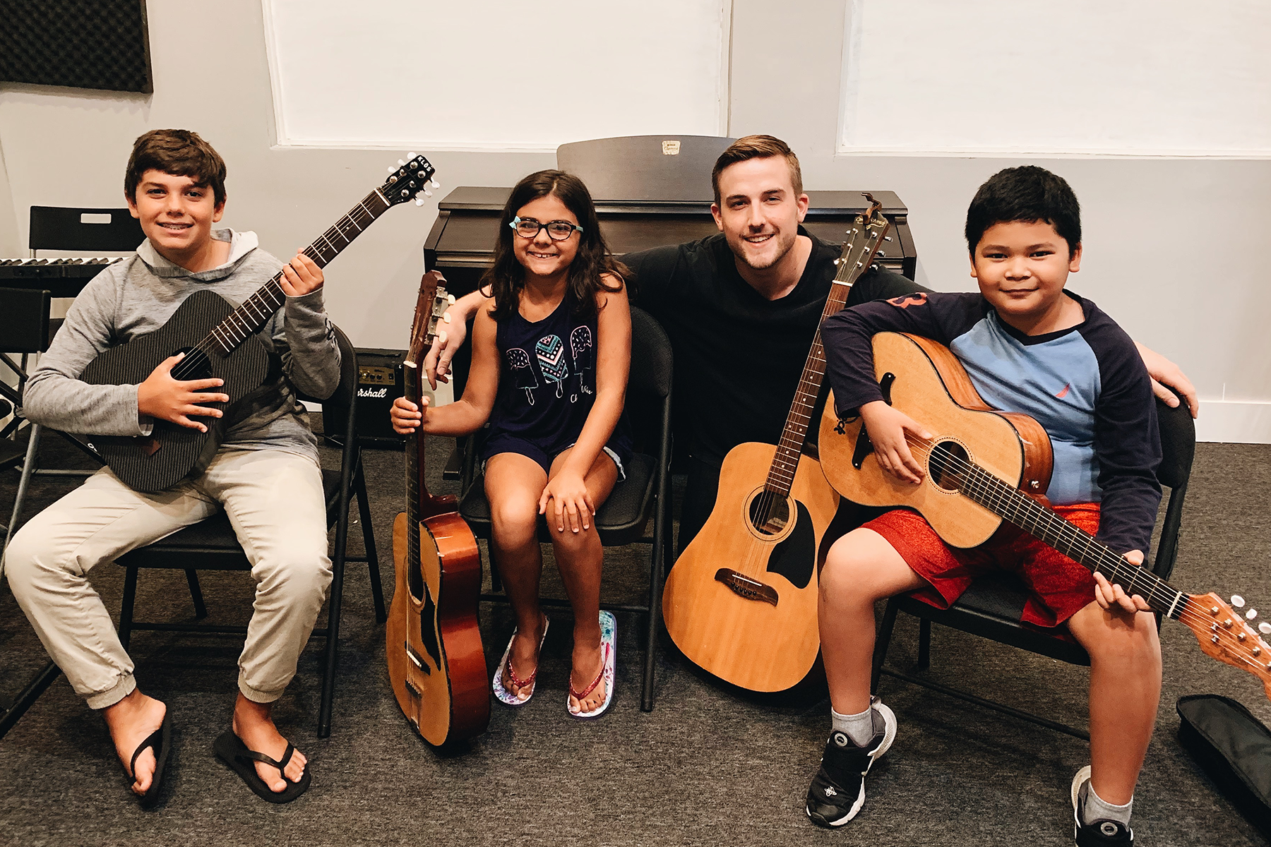 a group of people holding guitars