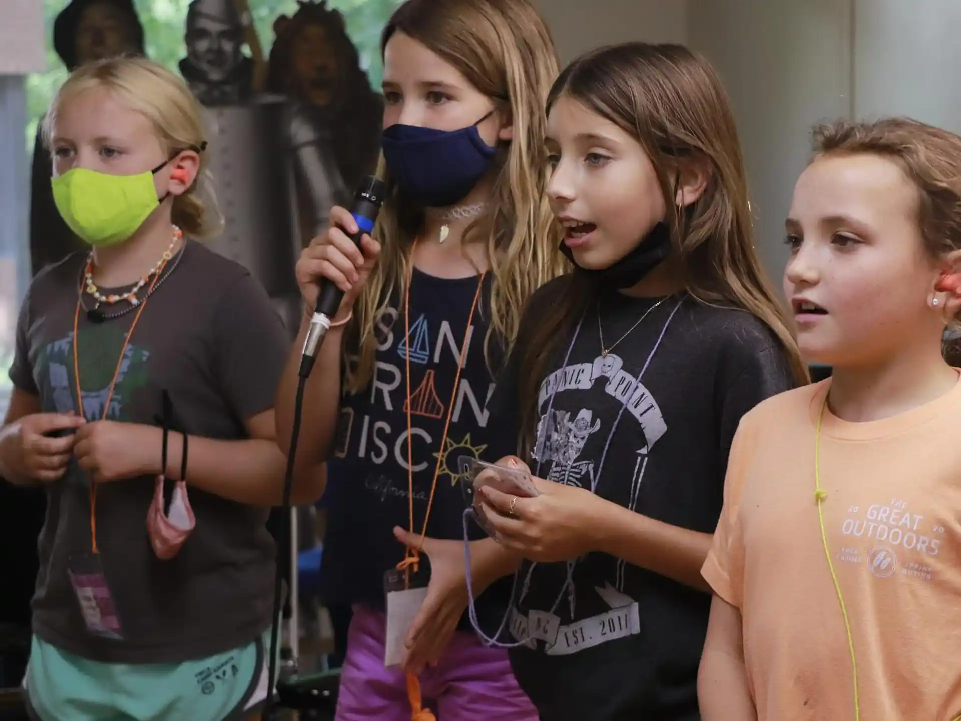 a group of girls with face masks