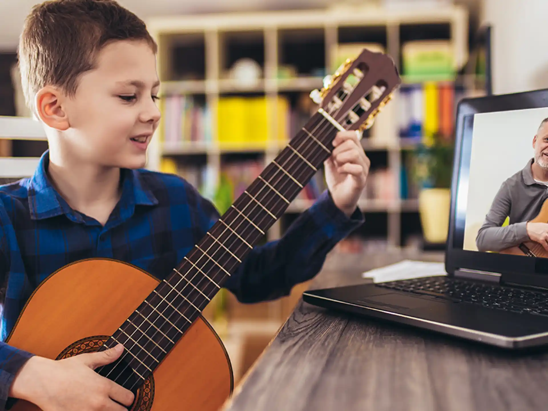 a boy playing a guitar