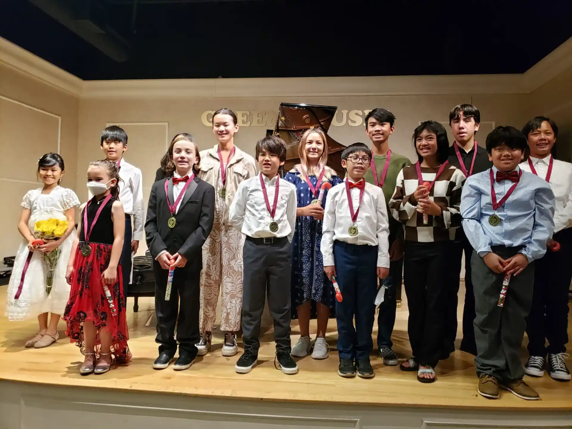 a group of people wearing medals