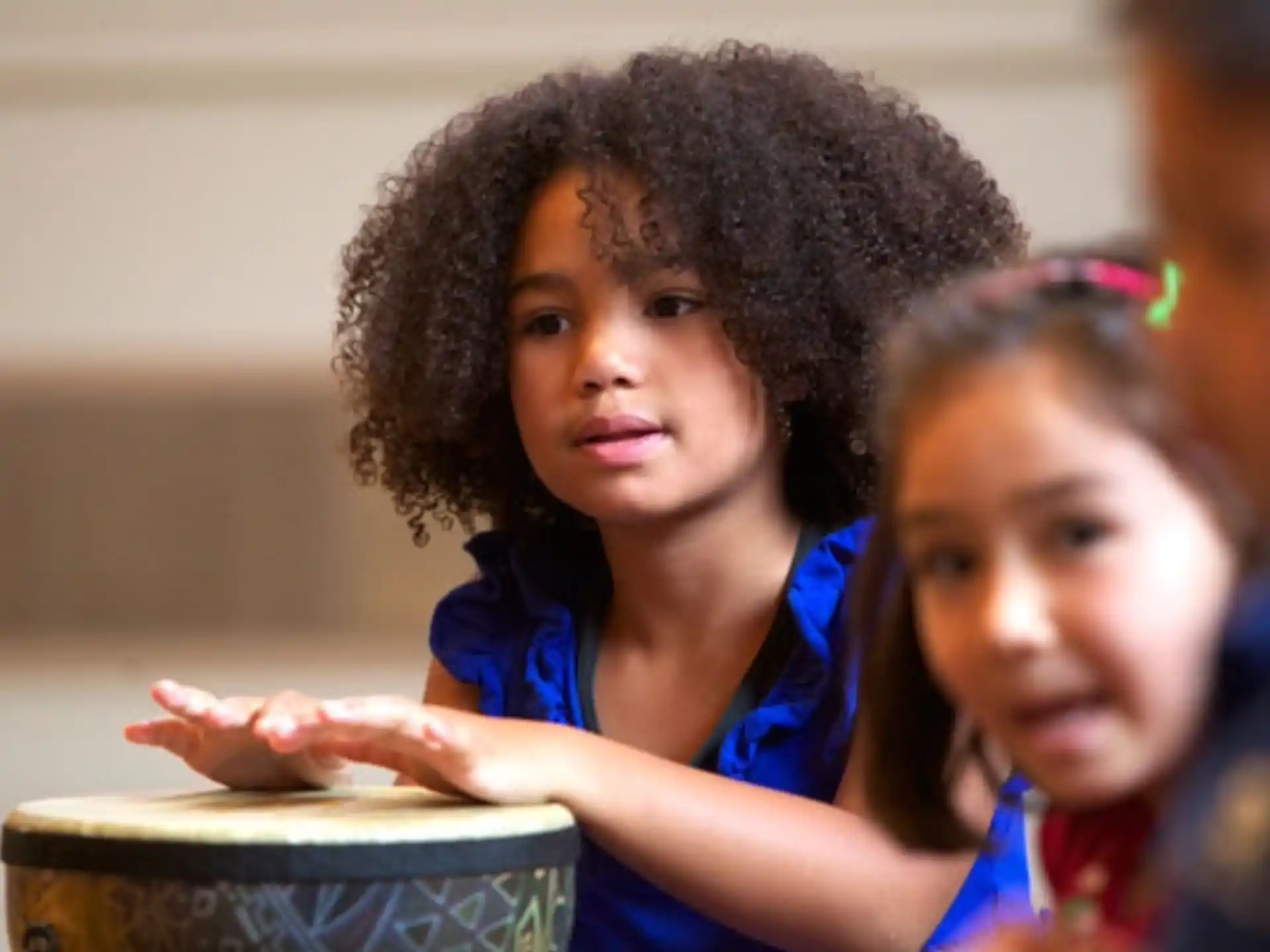 medium shot of kids holding a bowl