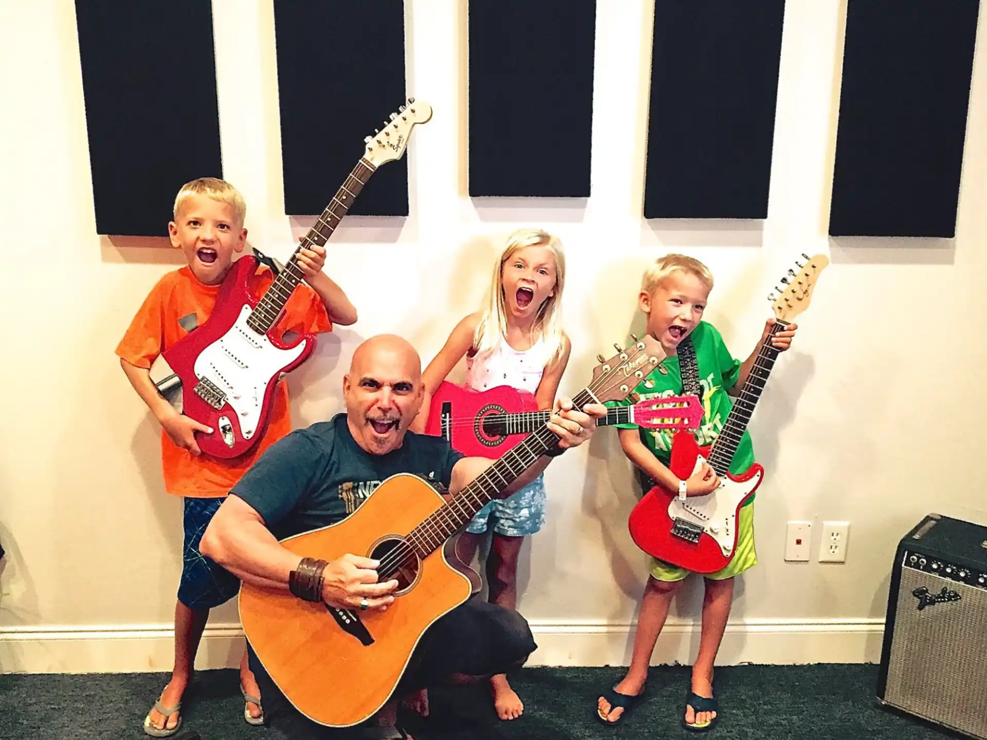 a group of people holding guitars
