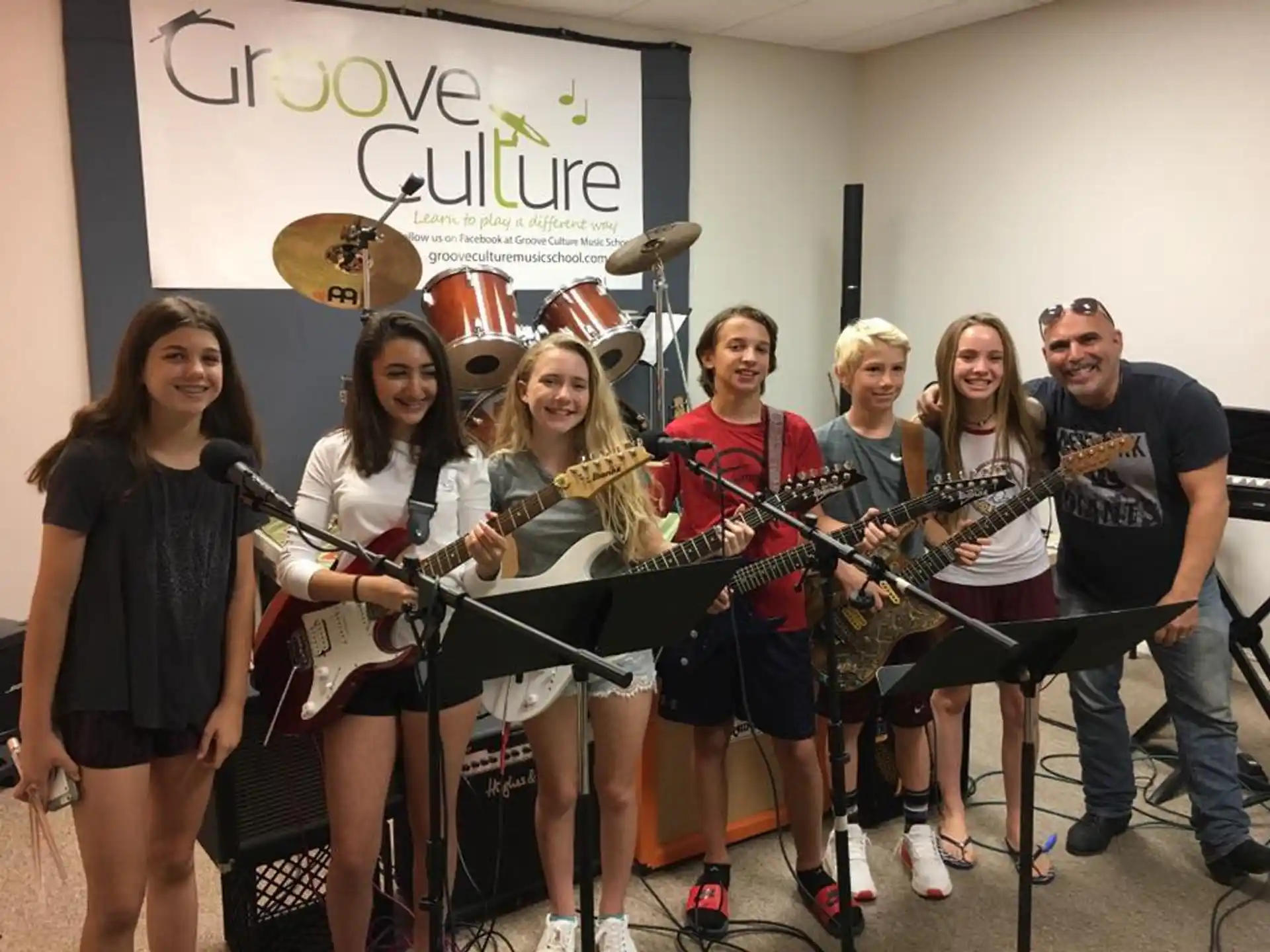 a group of people holding instruments