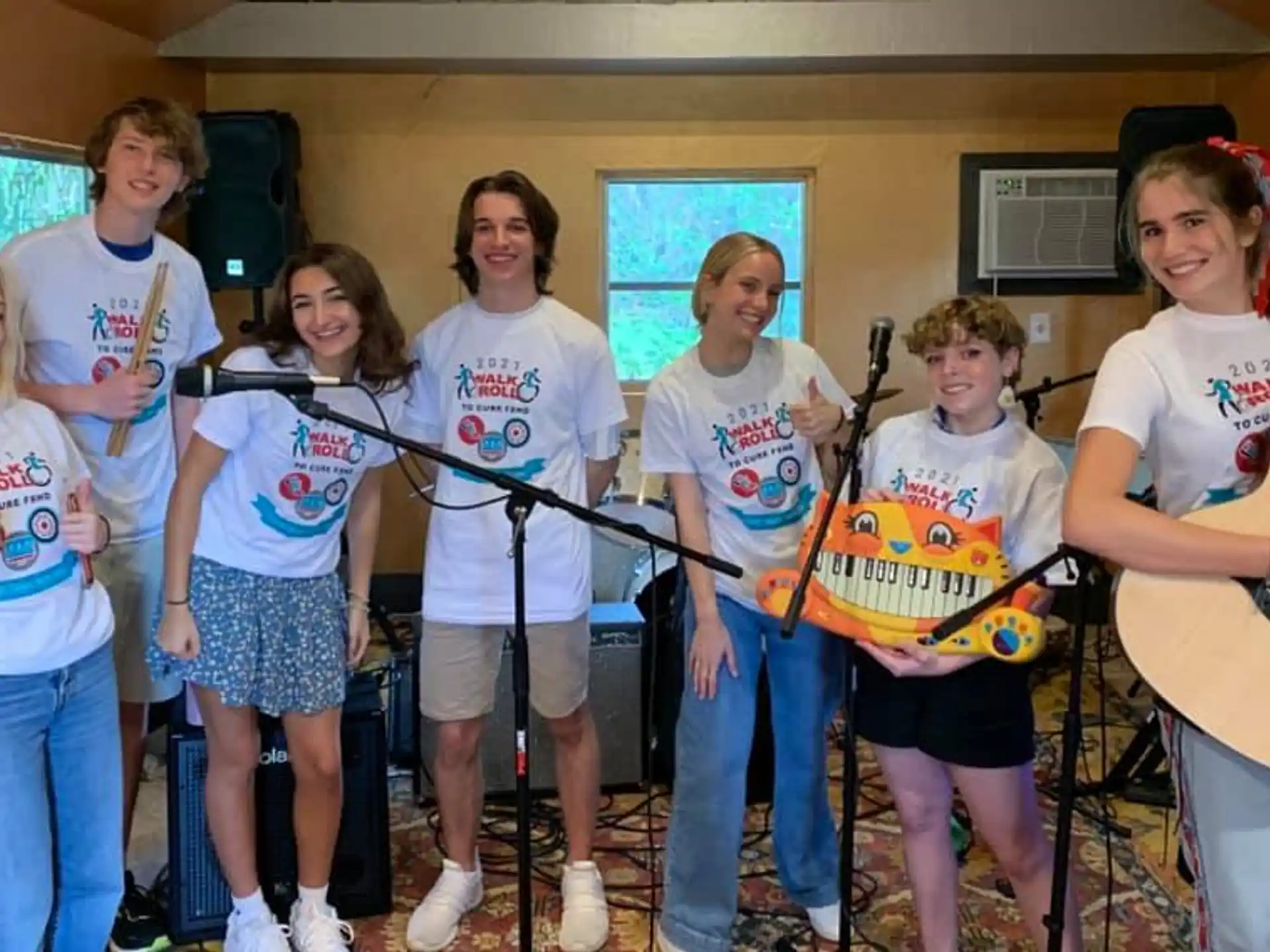 a group of people holding musical instruments