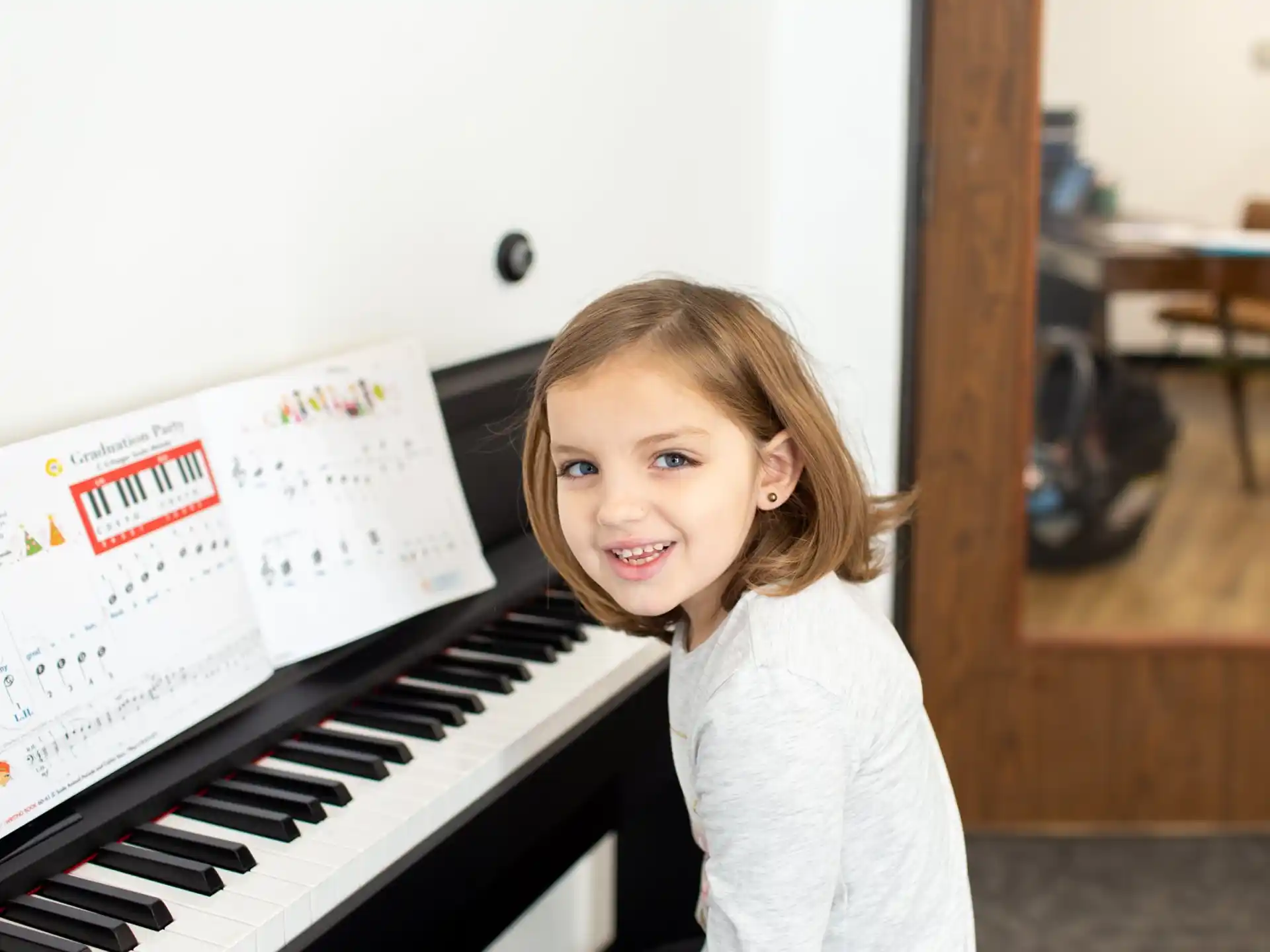 a girl playing a piano