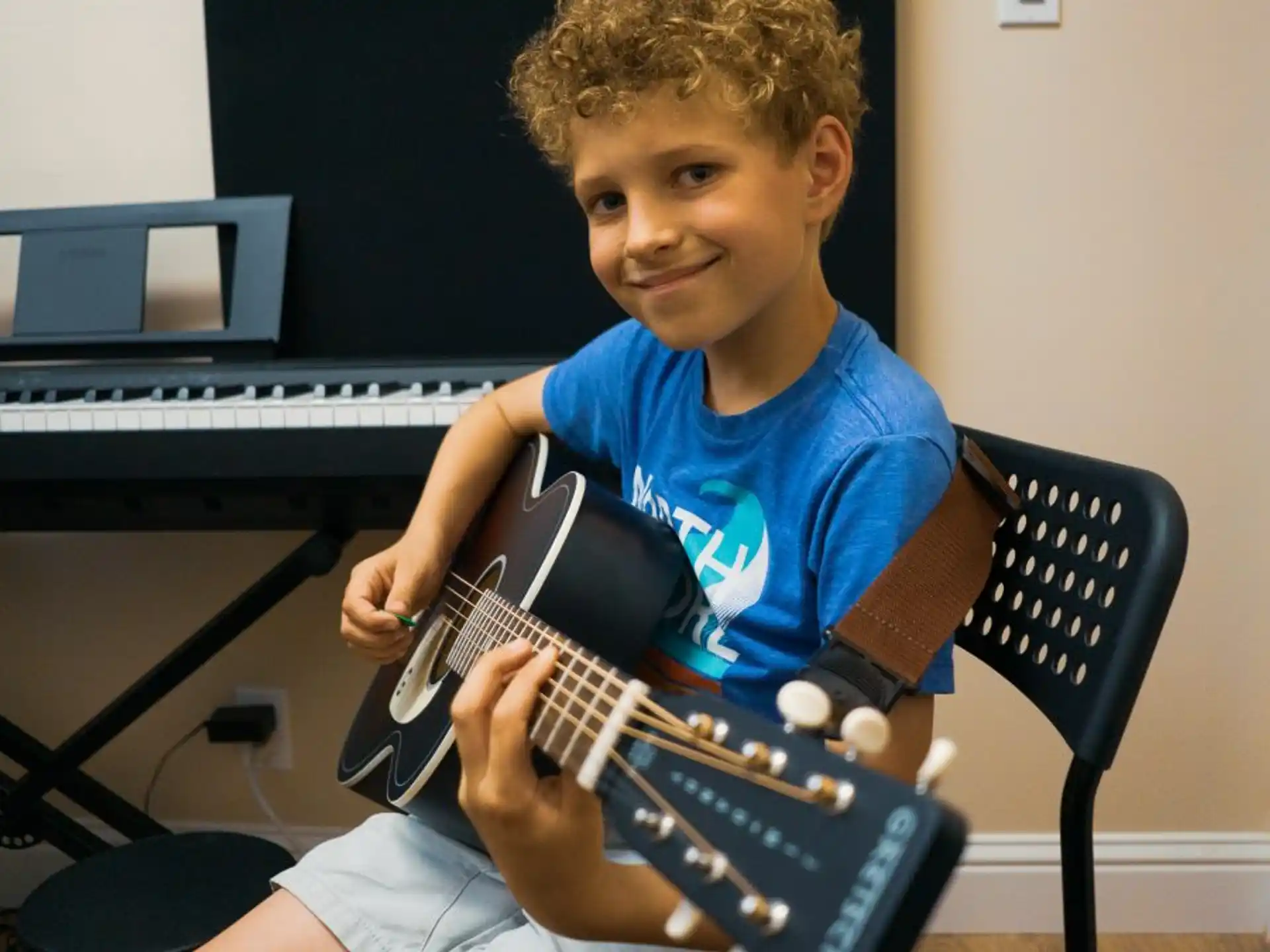 a boy playing a guitar