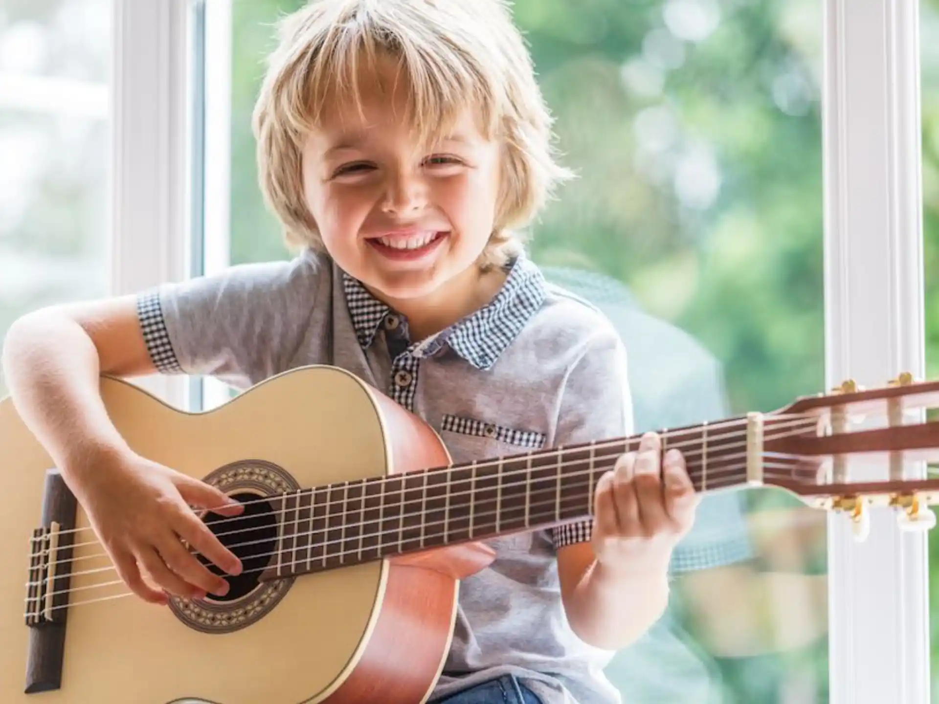 a boy playing a guitar