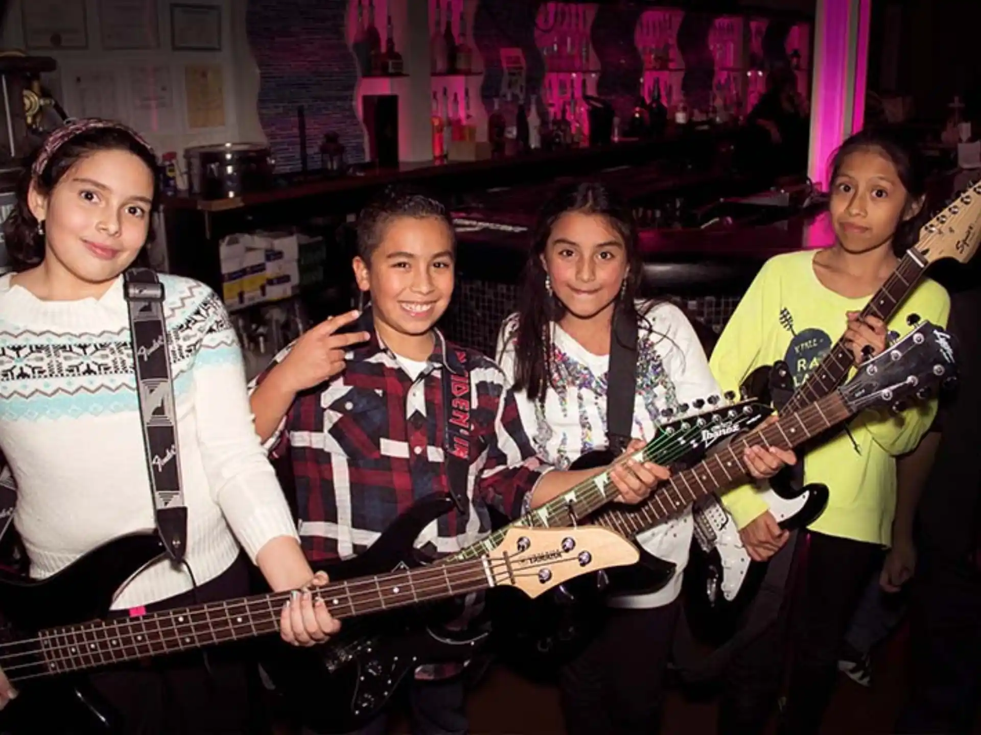 a group of people holding guitars