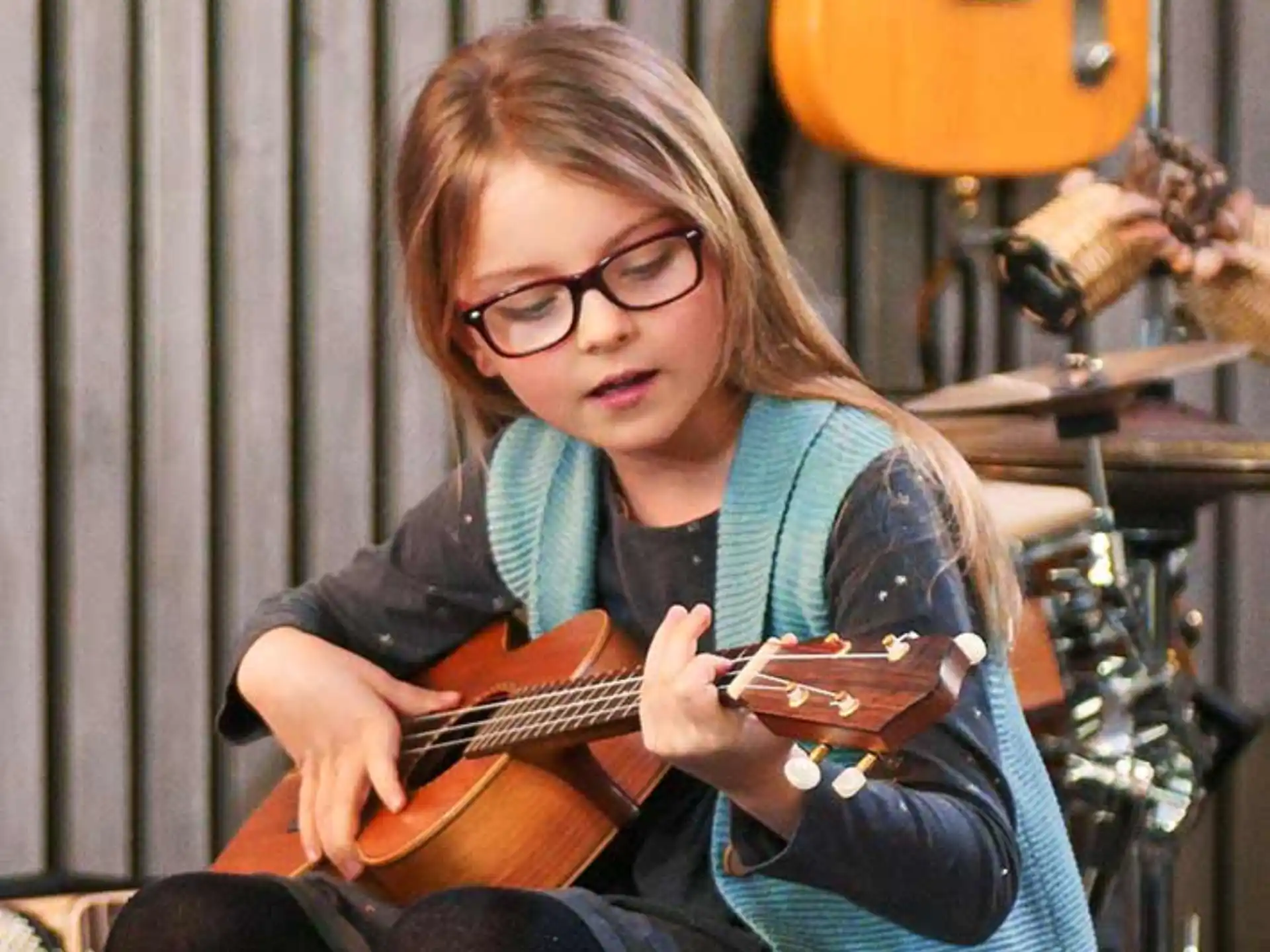 a woman playing a guitar