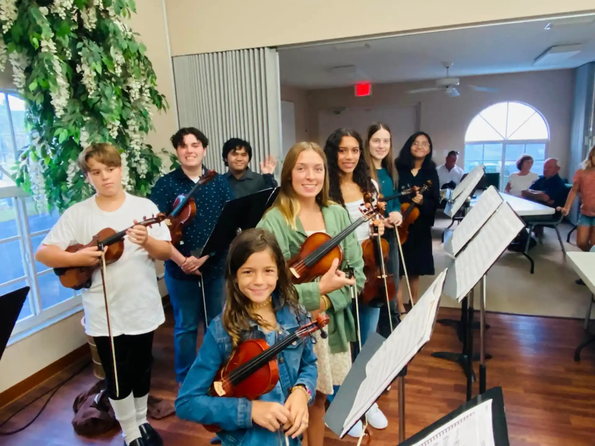 a group of people holding instruments