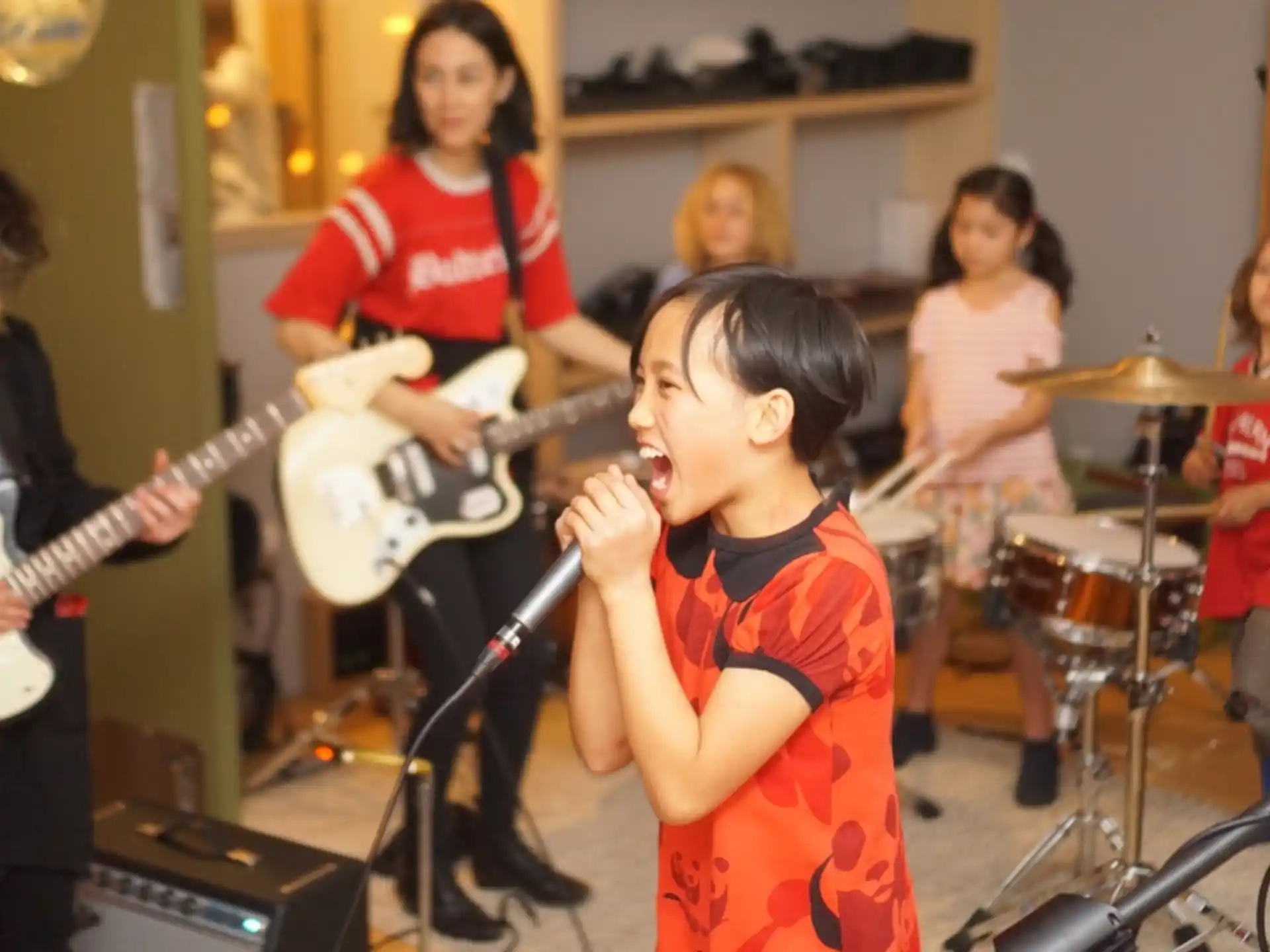 a group of kids playing instruments