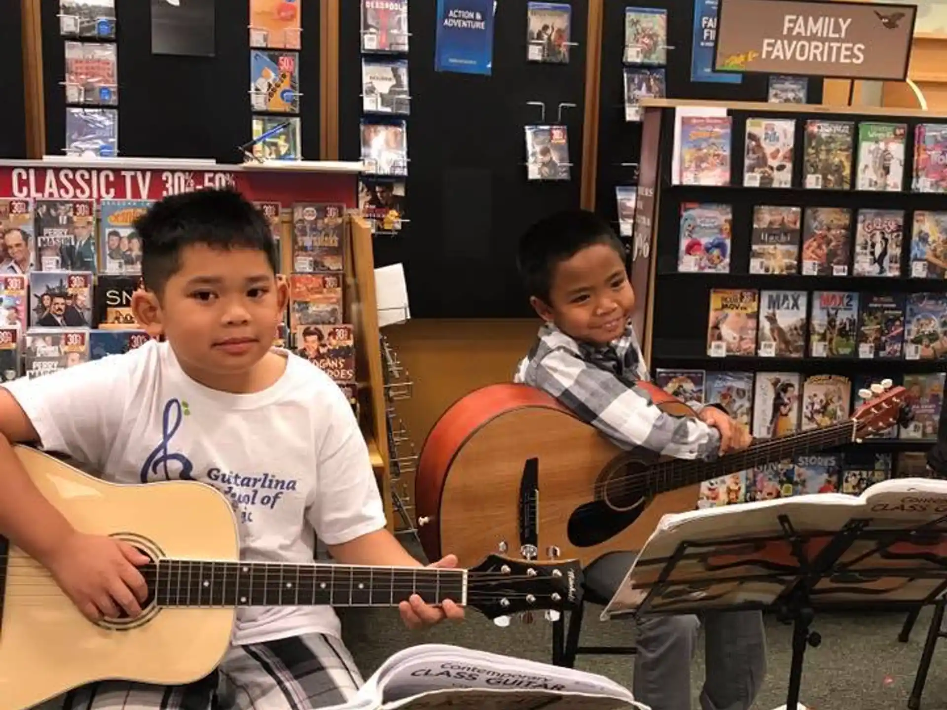 a group of boys playing guitars