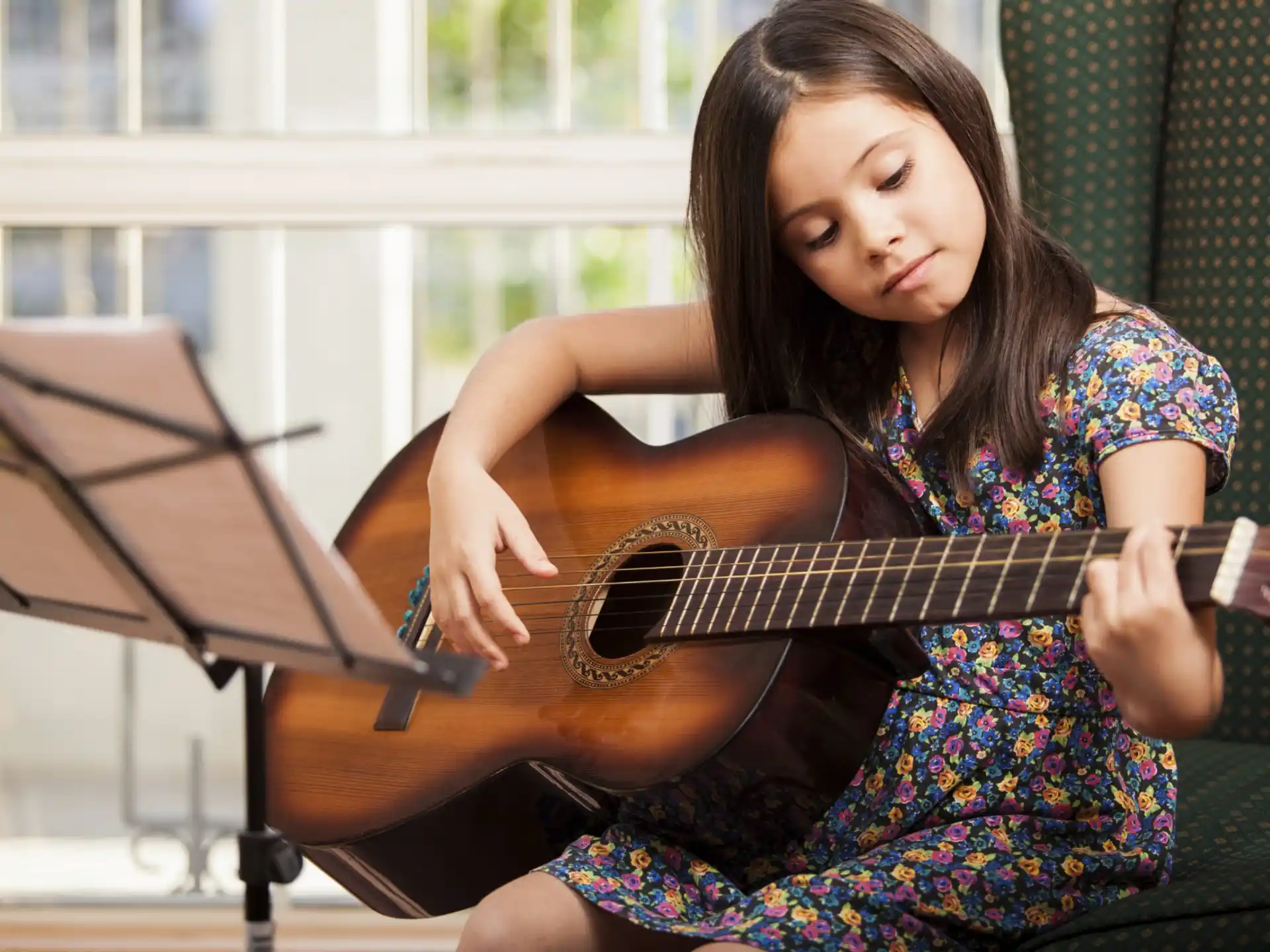 a woman playing a guitar