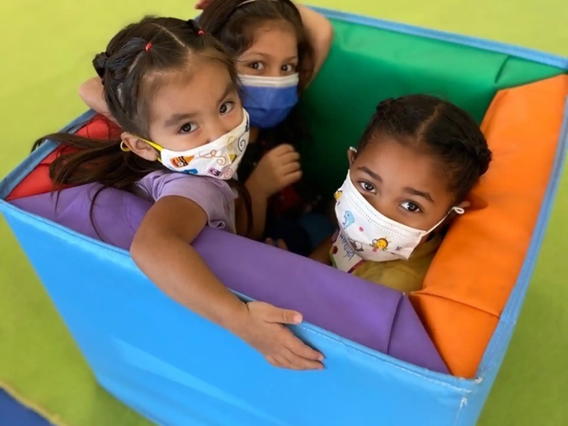 a group of children in a slide
