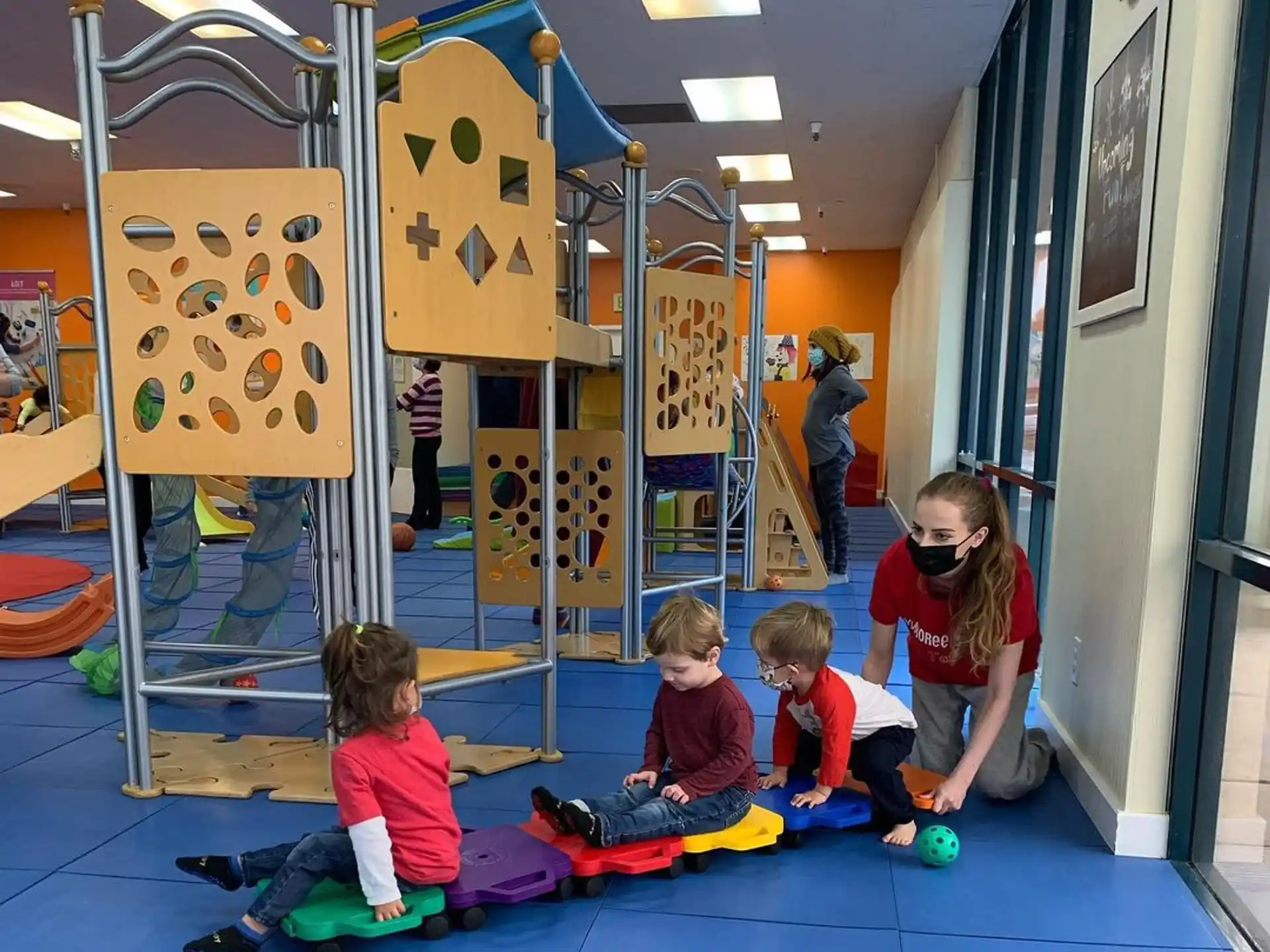a group of children playing in a gym