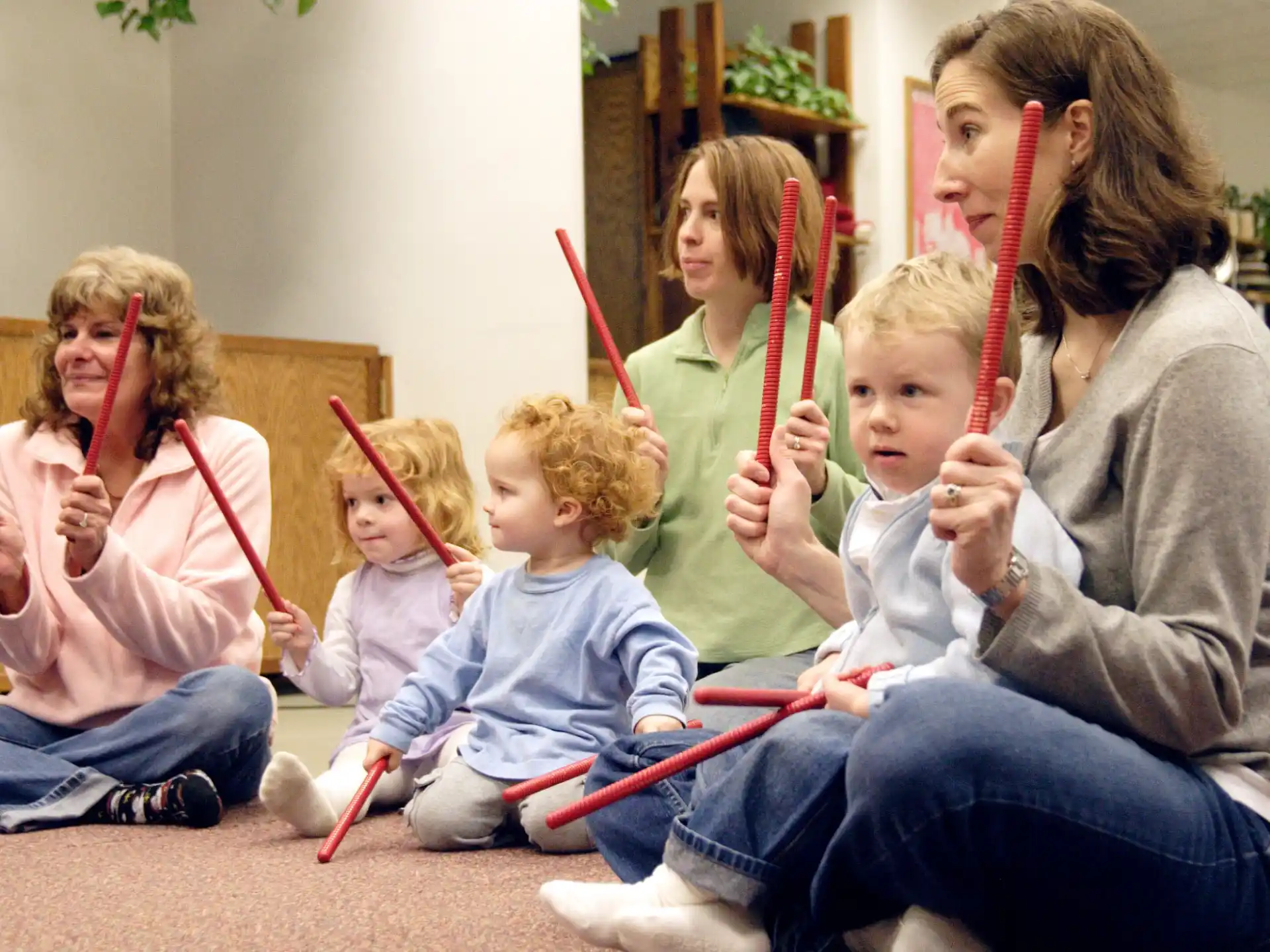 a group of children holding bows and arrows