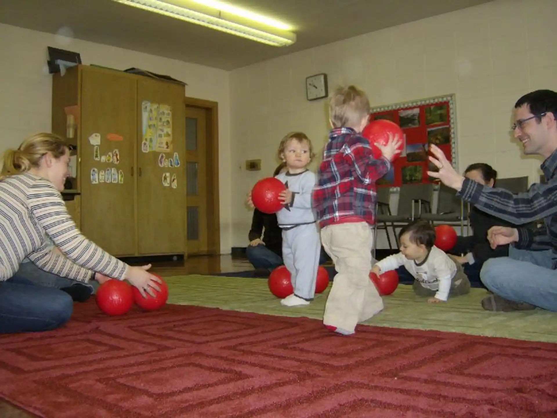 a group of people playing with balls