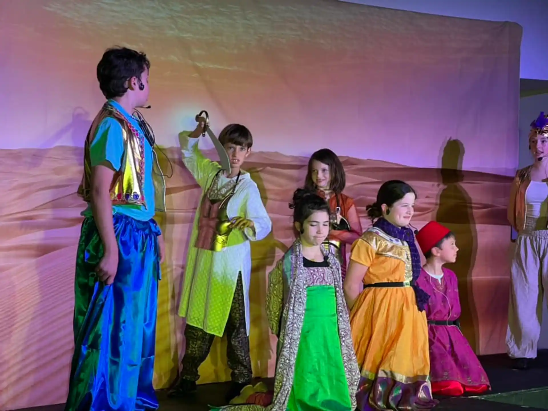 a group of people in colorful dresses