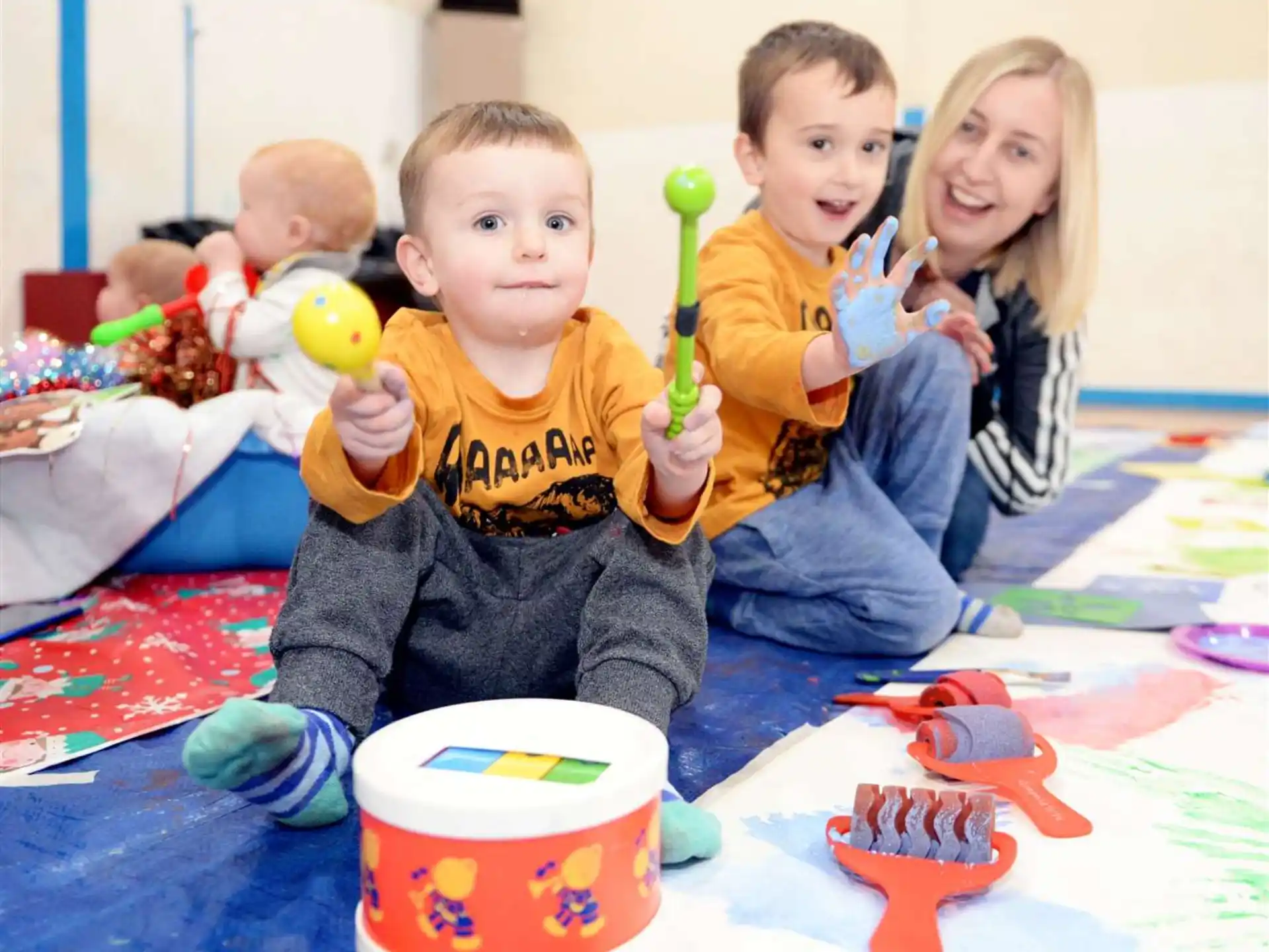 kids holding toothbrushes and toys