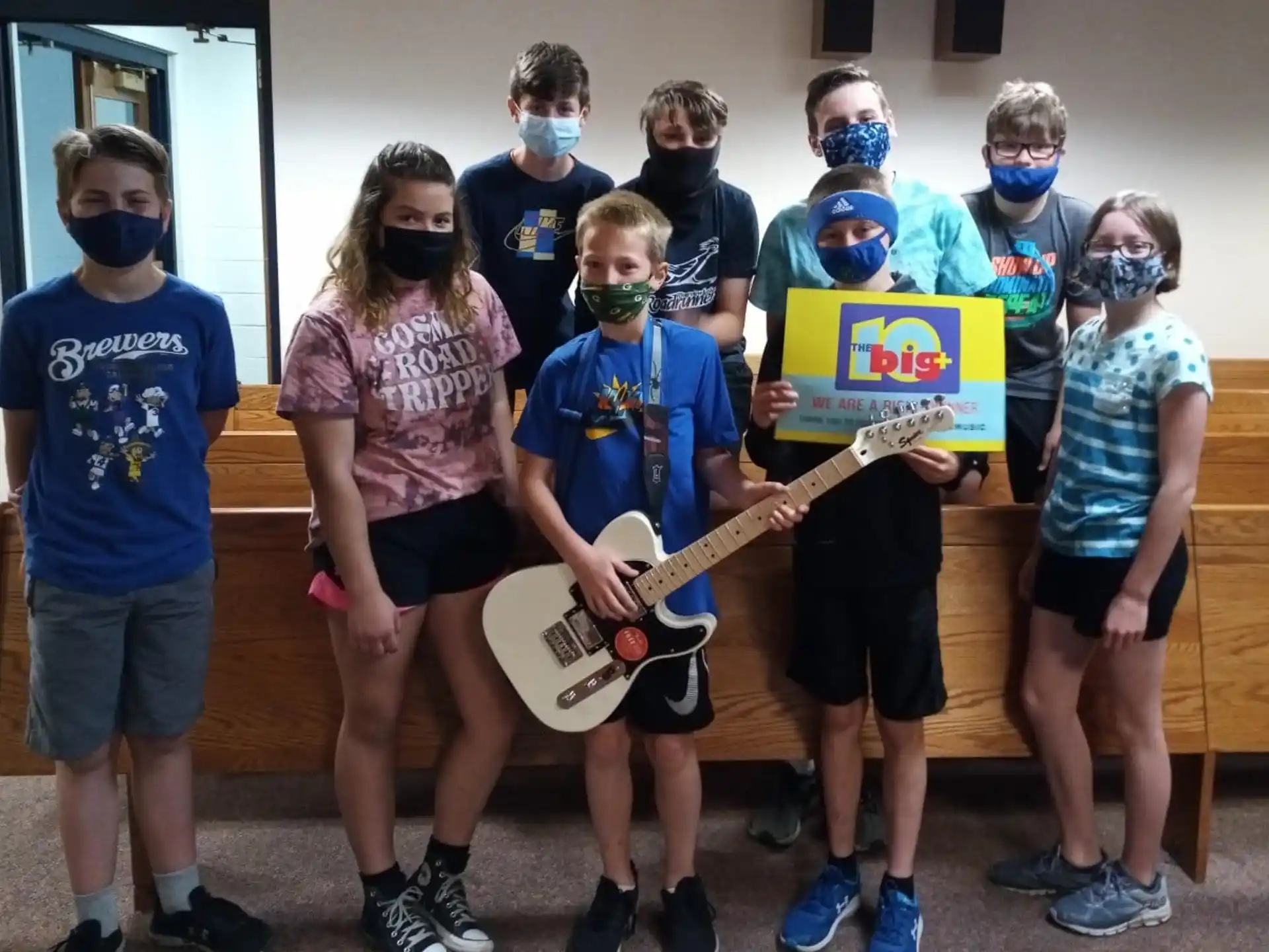 a group of kids with masks on their faces