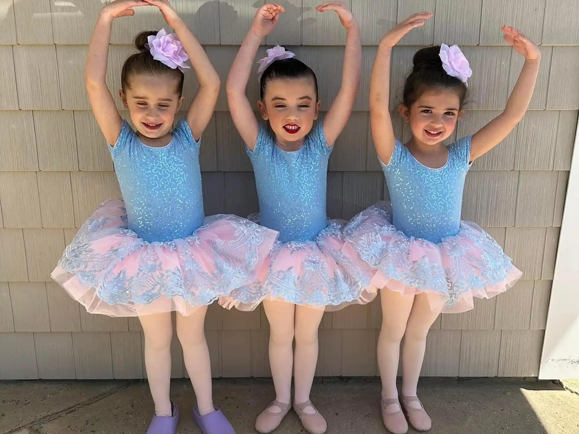 a group of girls in dresses