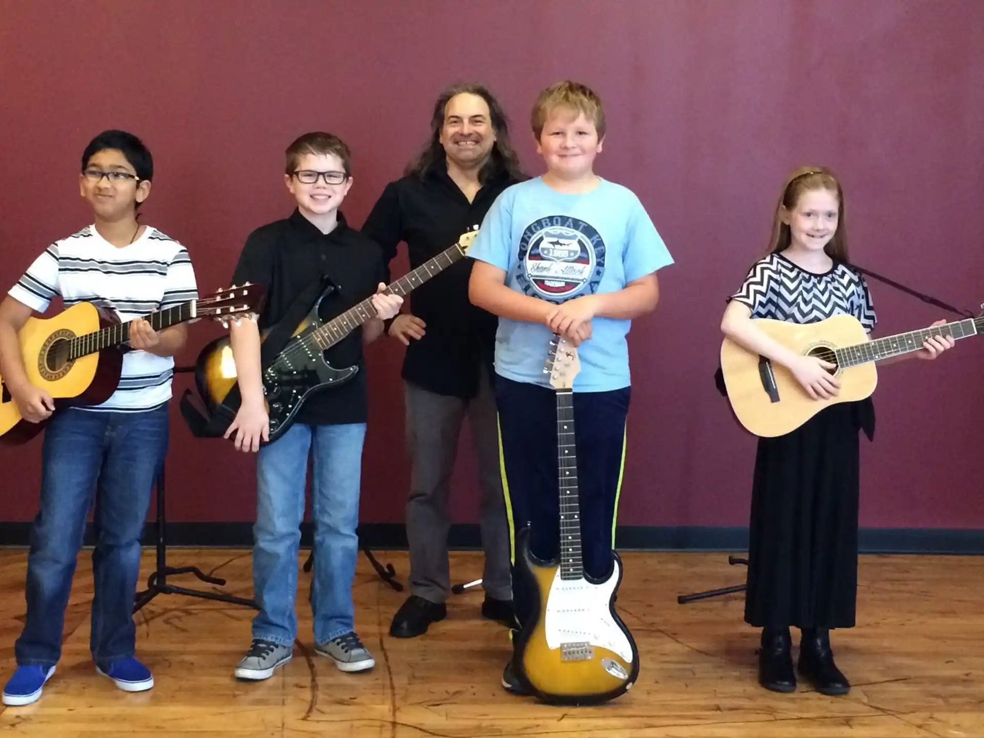 a group of people holding guitars