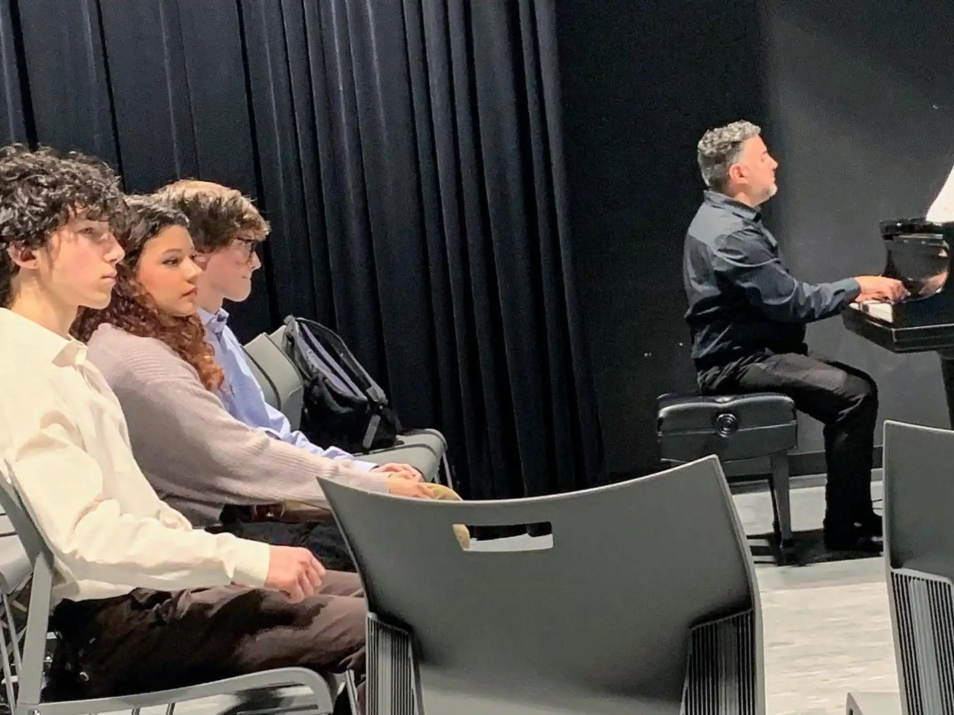 a group of people sitting in chairs