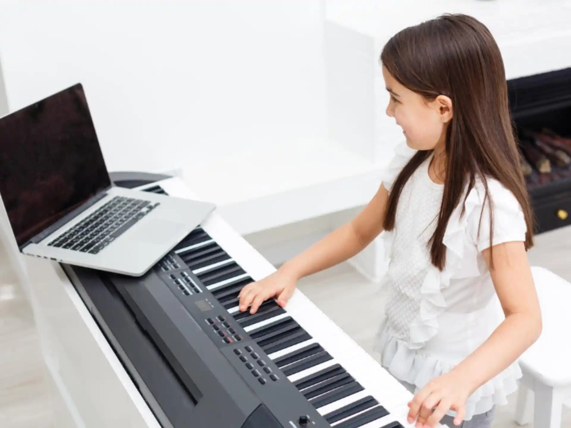a woman playing a piano
