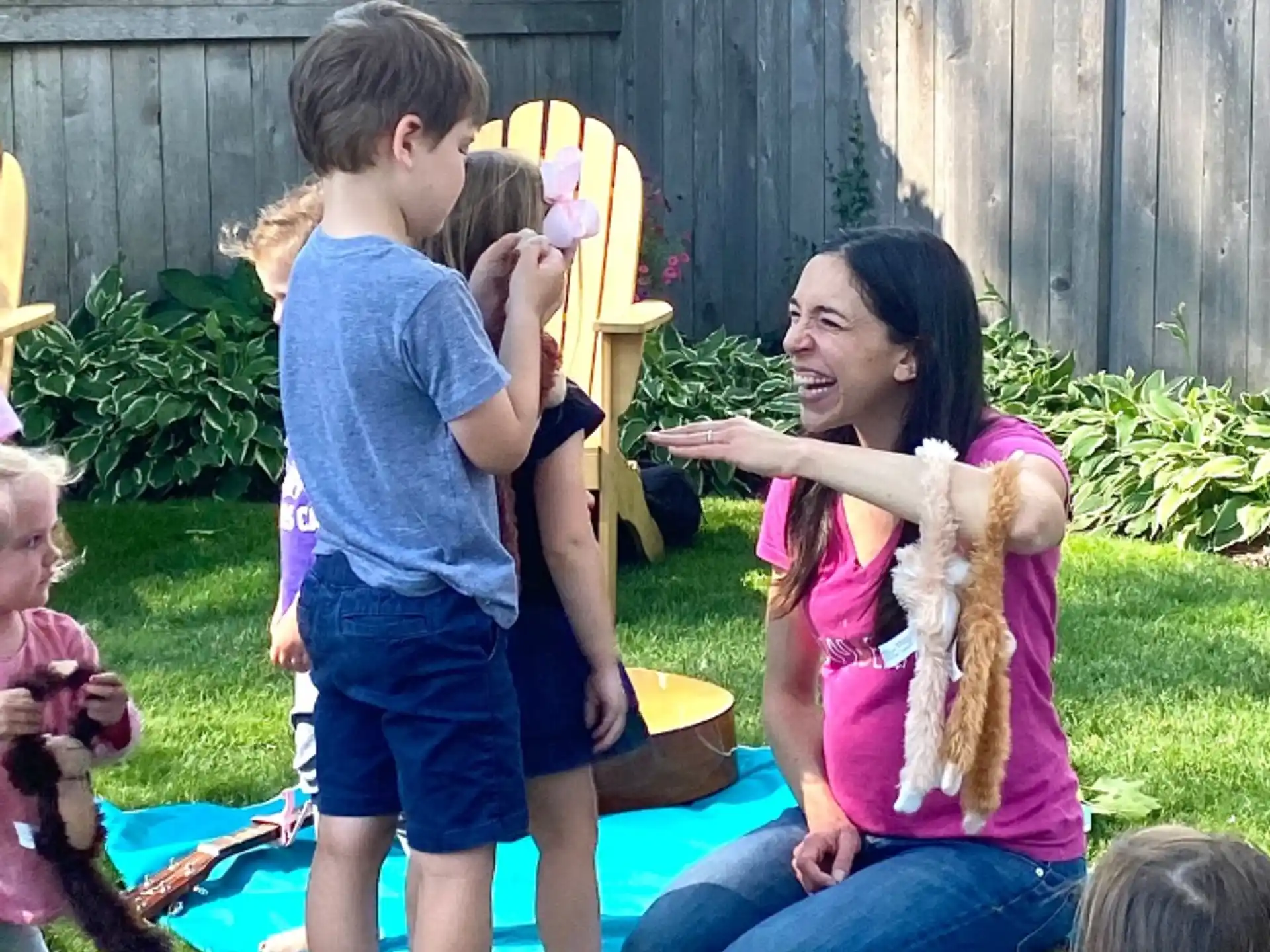 a person and a boy playing with a toy
