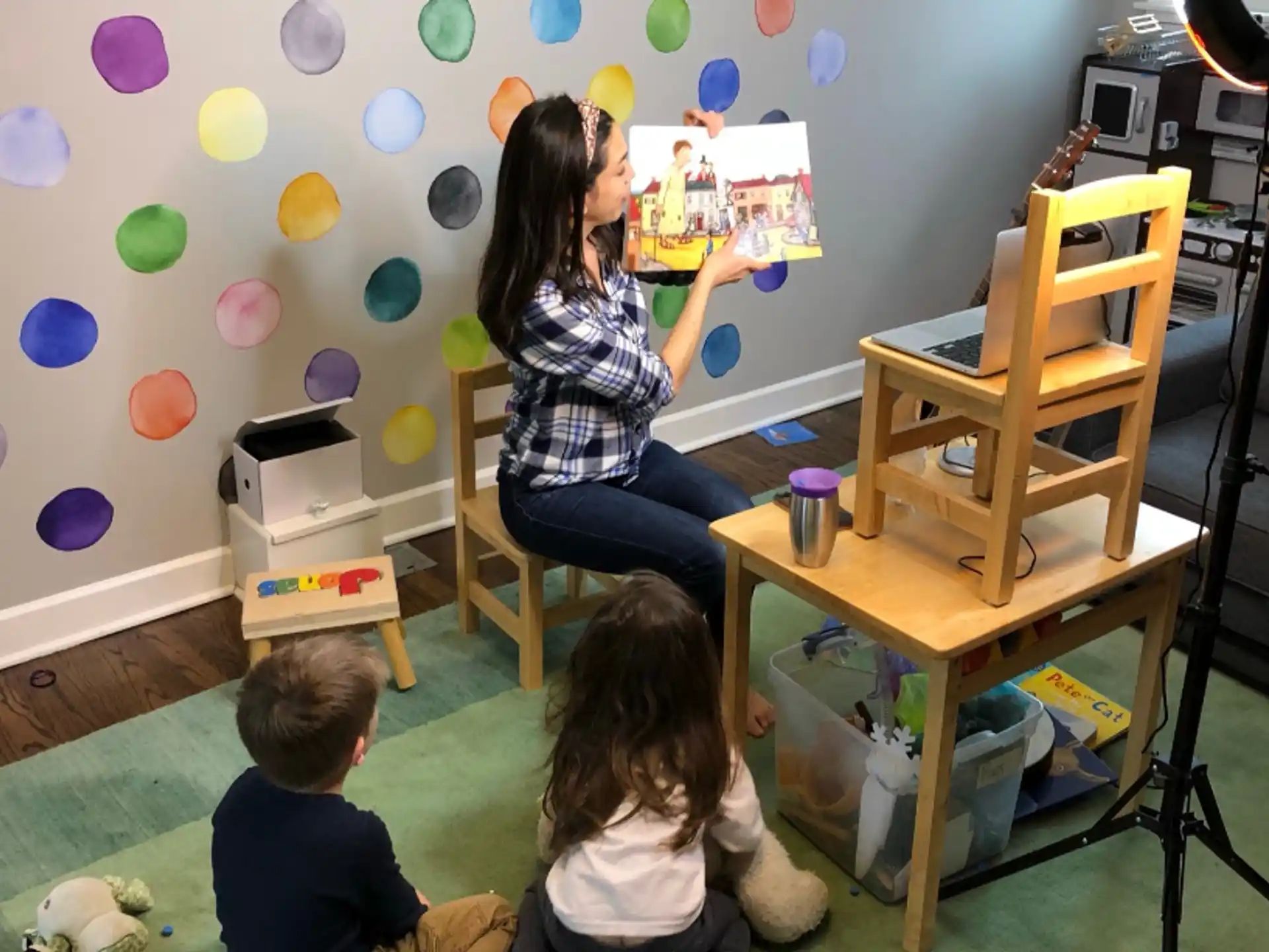 a woman teaching children in a classroom