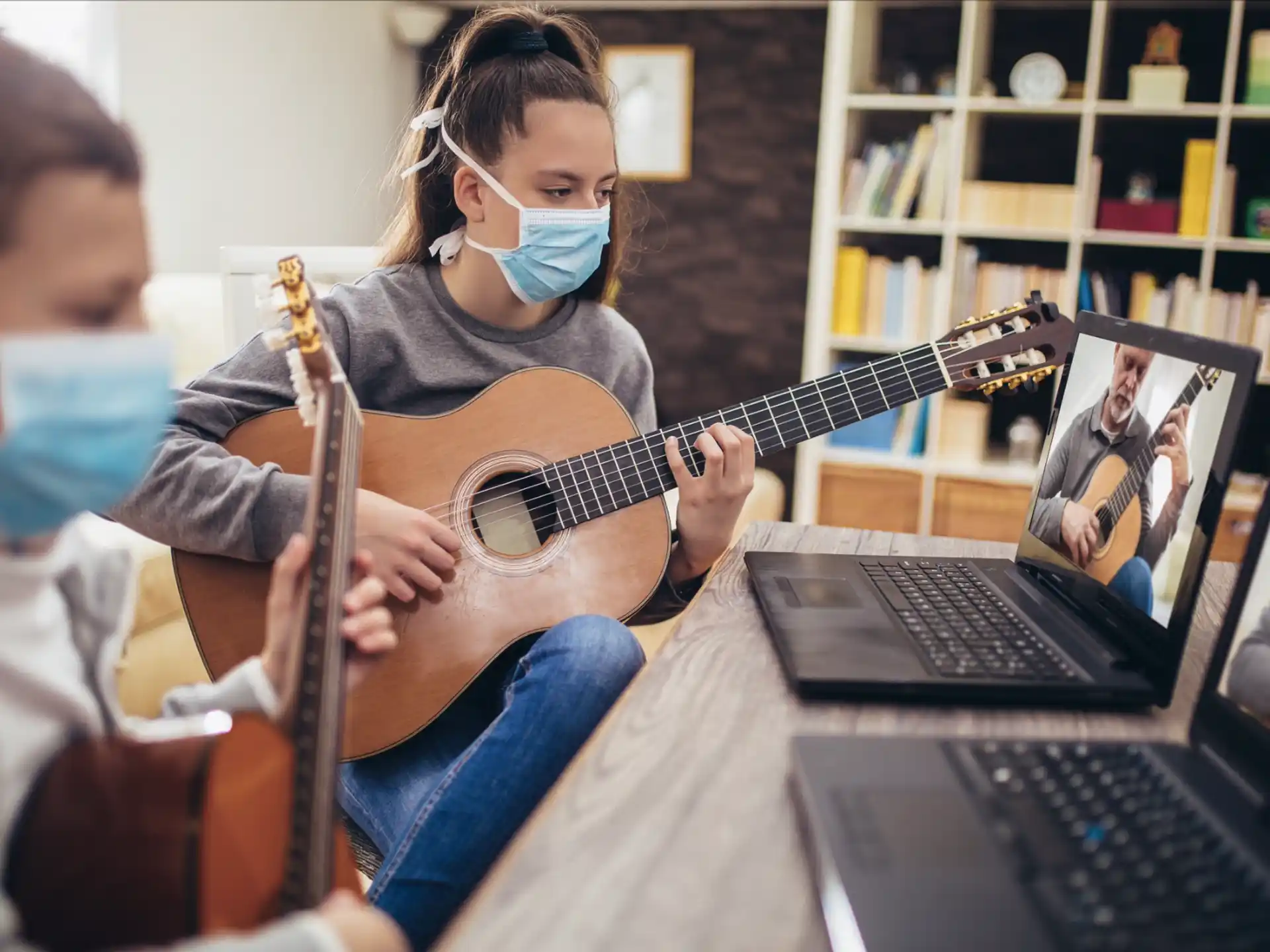 a person playing a guitar