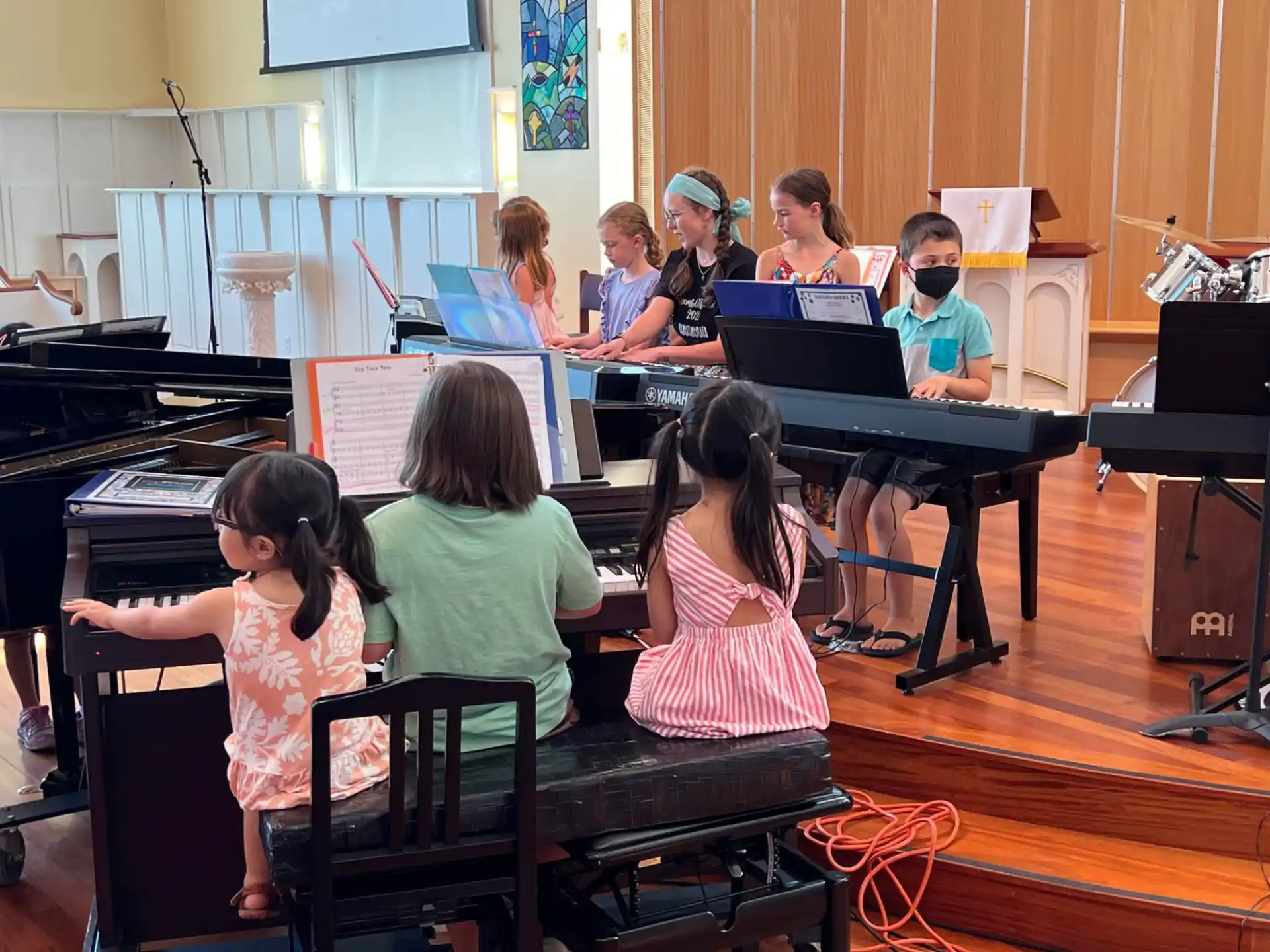 a group of children playing instruments