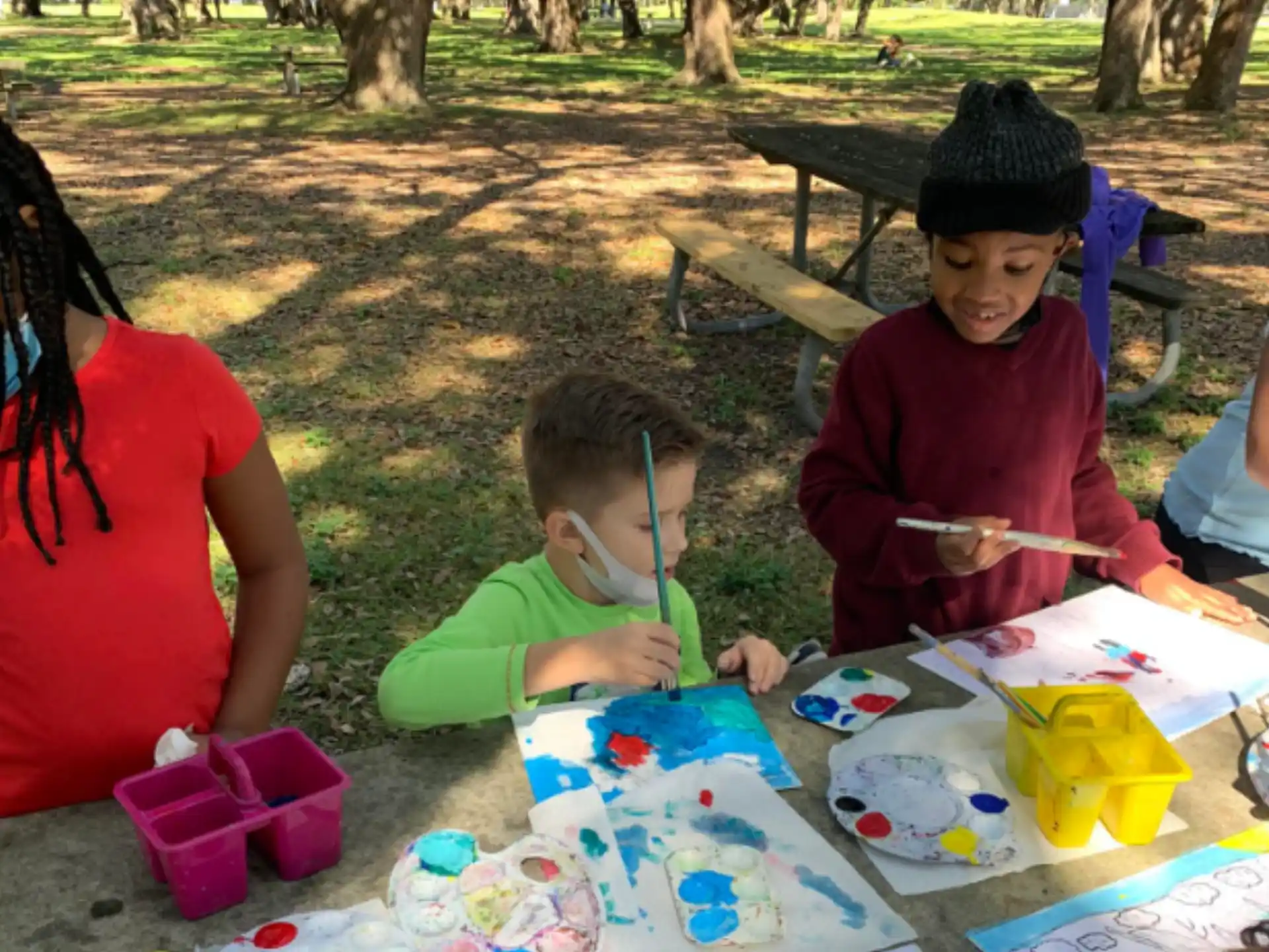 a group of children painting