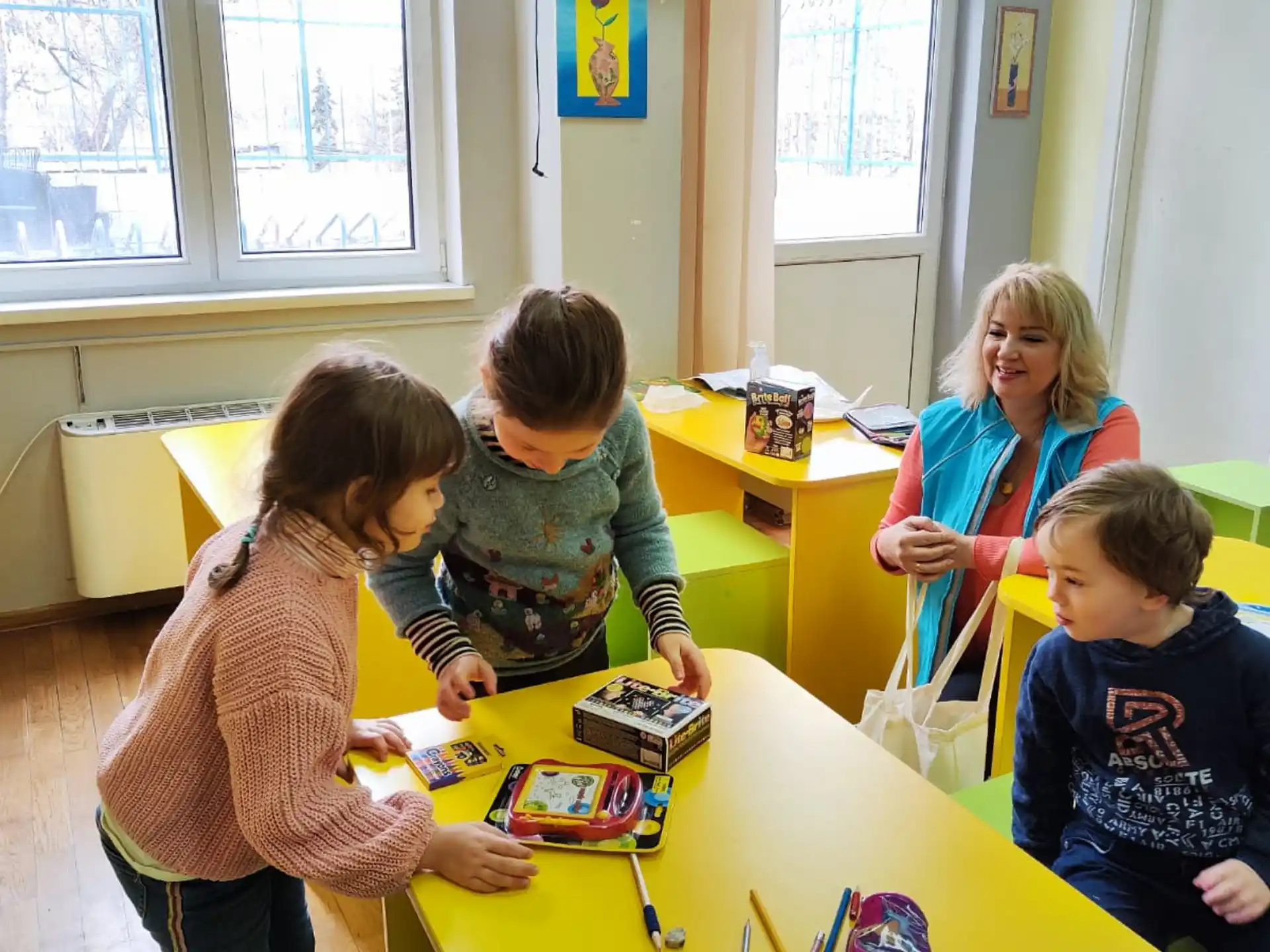 a group of children playing with toys