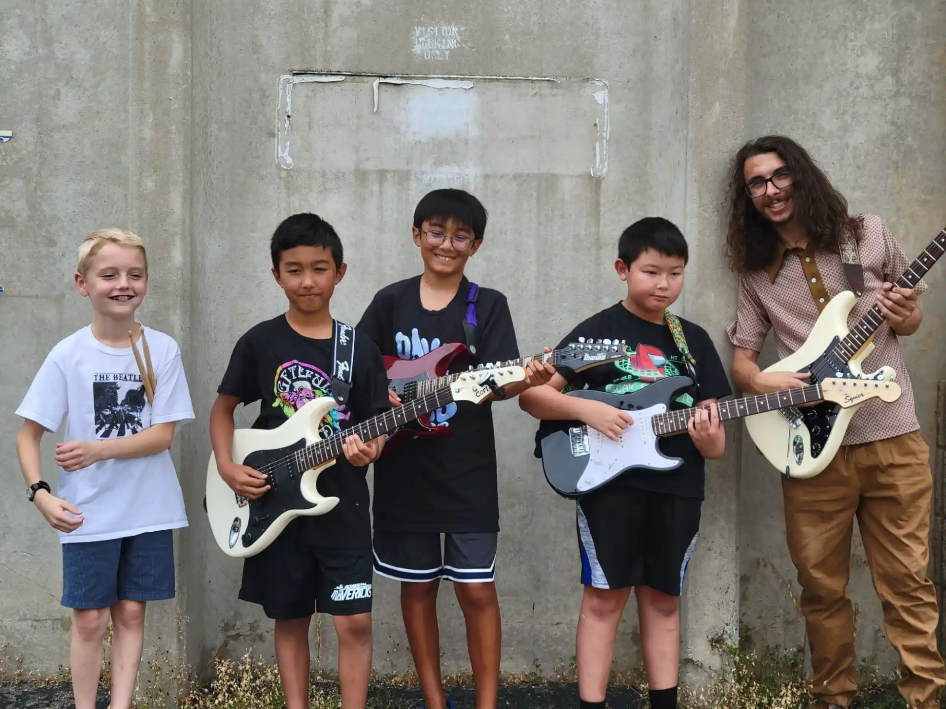 a group of people holding guitars