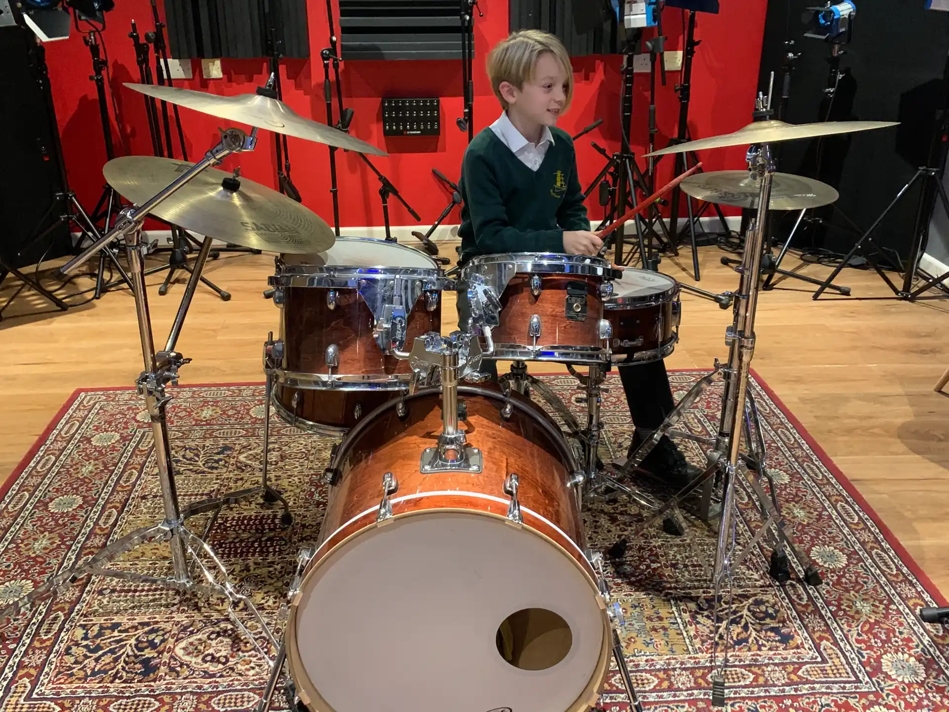 a boy playing drums
