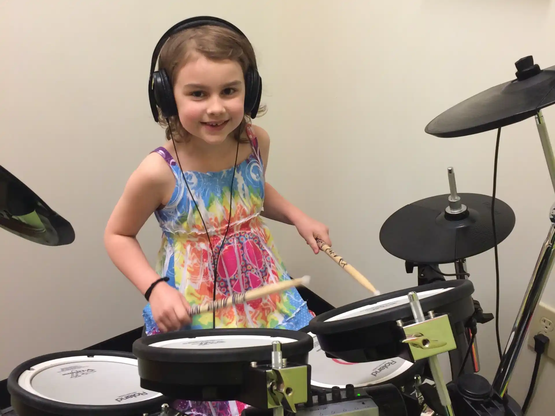 a girl playing the drums