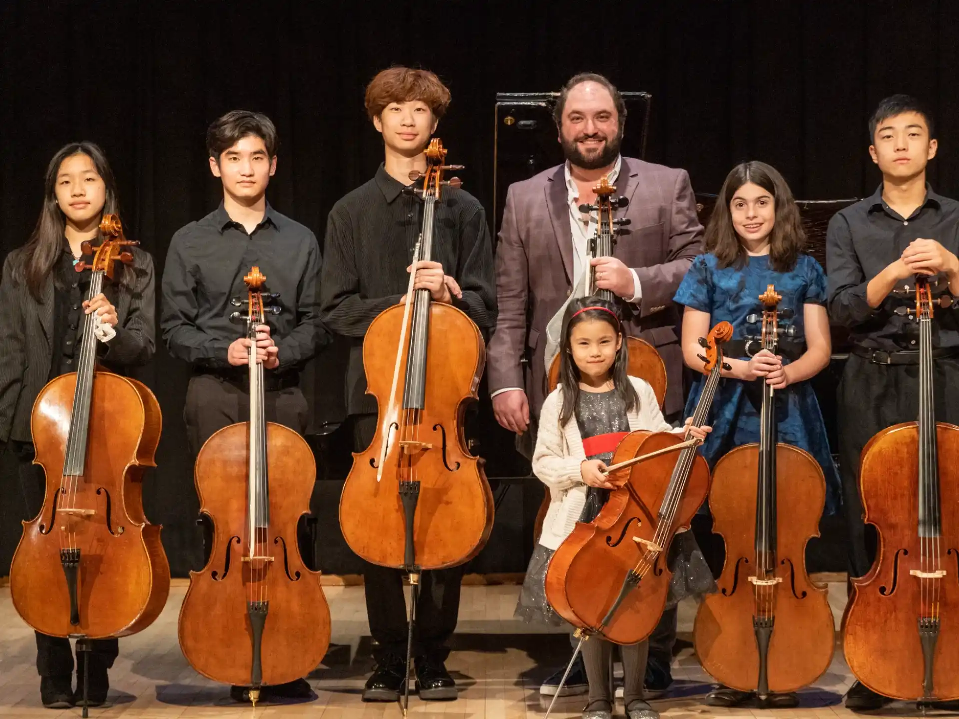 a group of people holding instruments