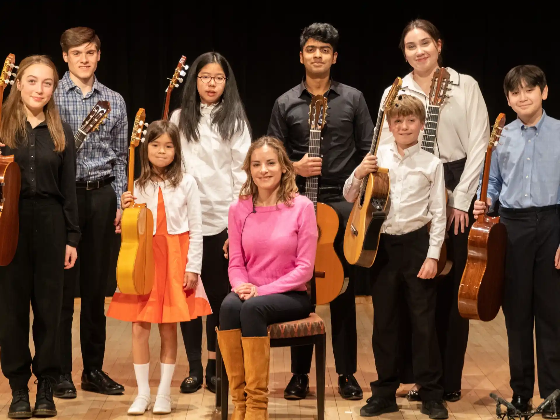 a group of people holding musical instruments