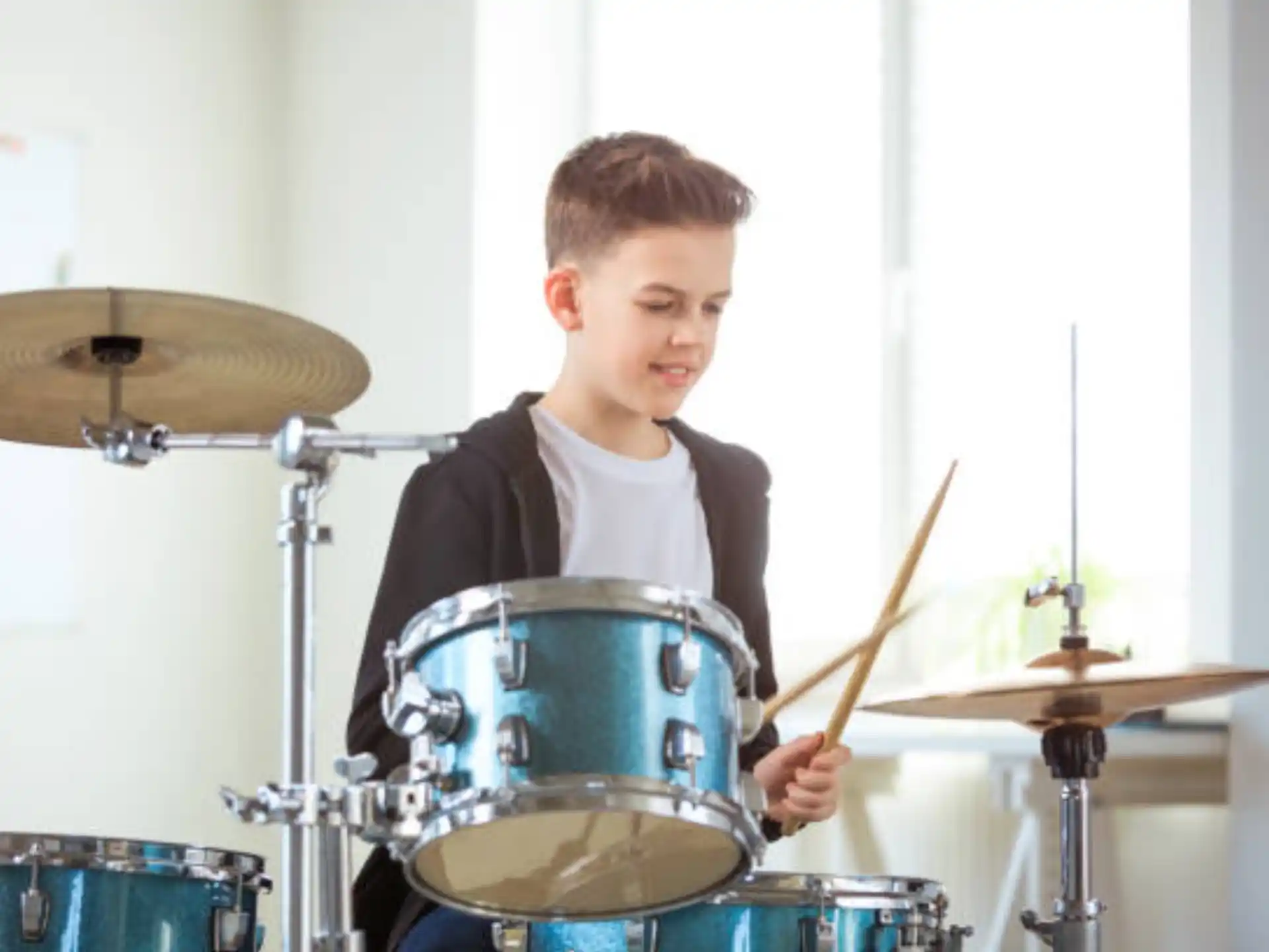 a boy playing drums