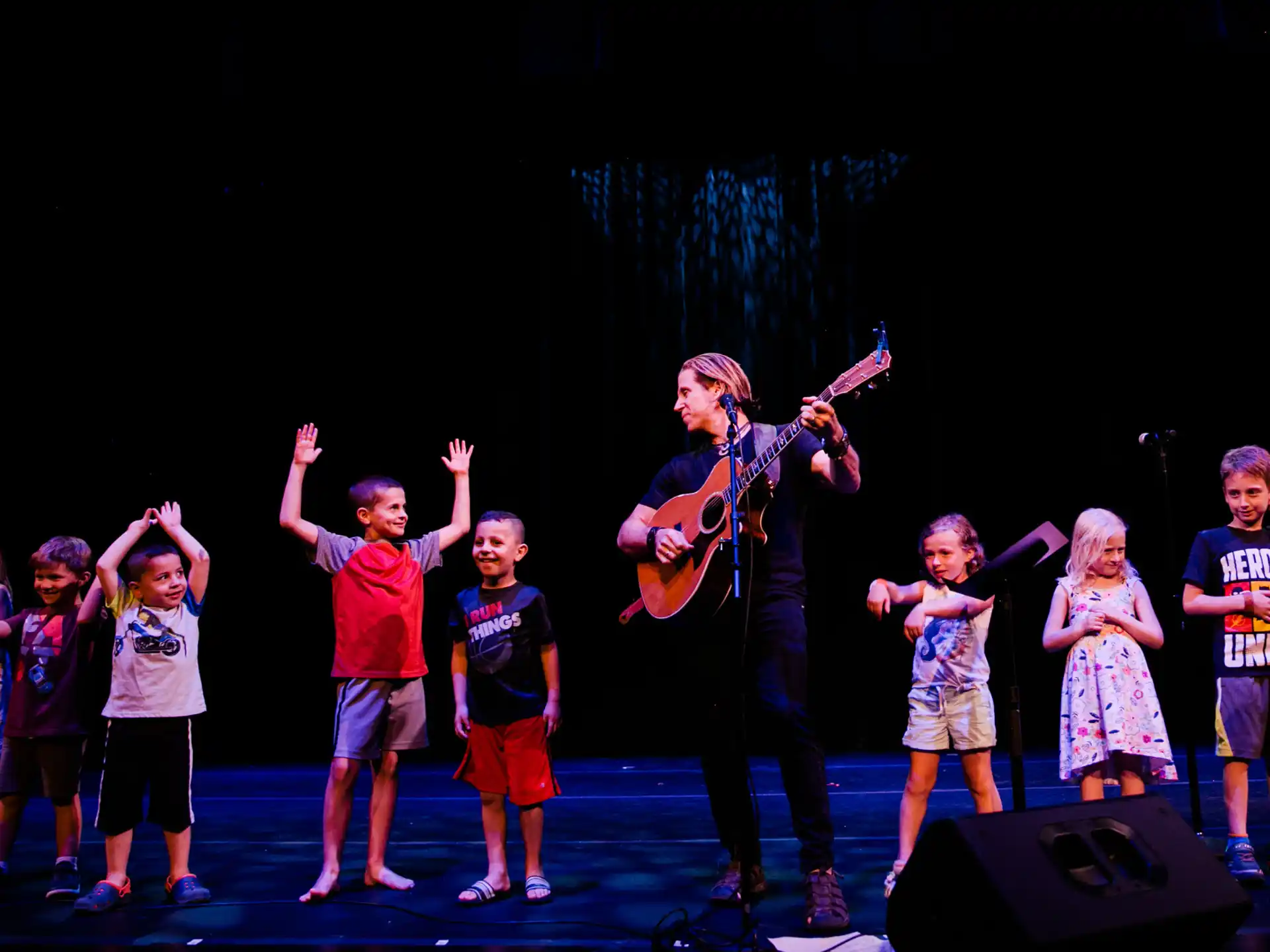a group of children on a stage