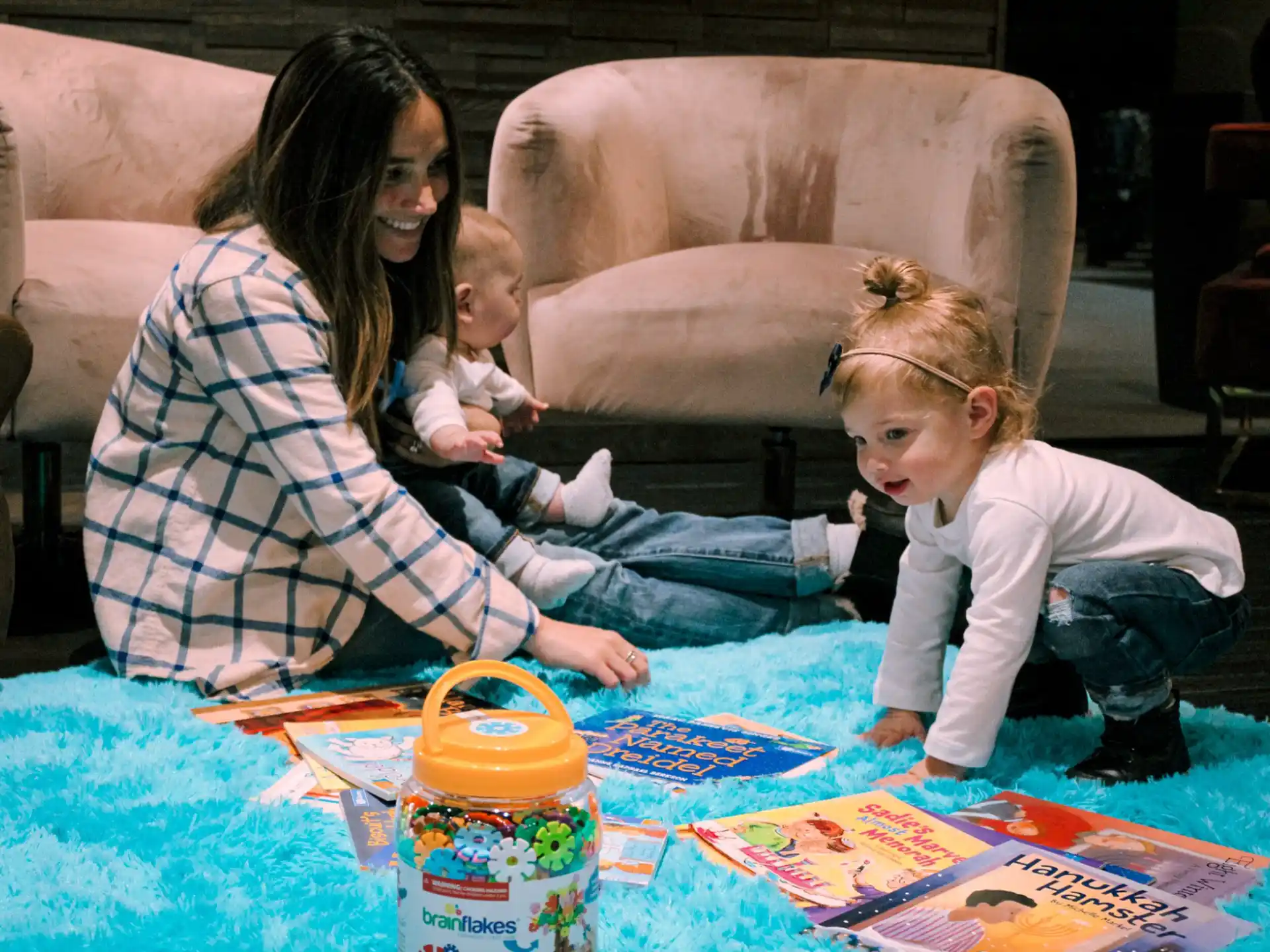 a woman and a child playing with a toy