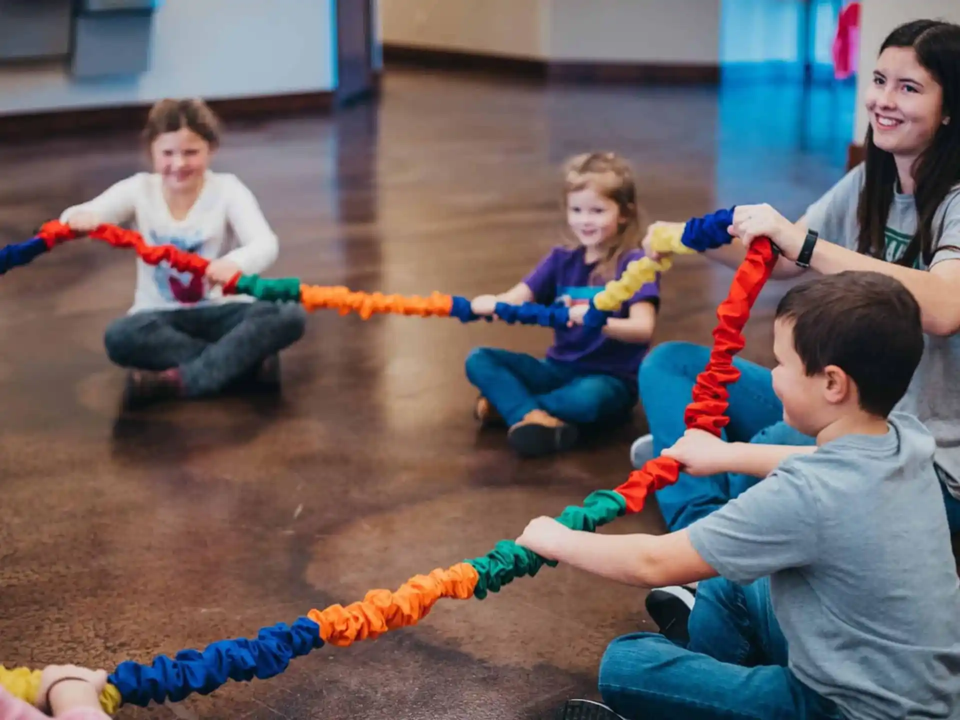 a group of children playing with a toy