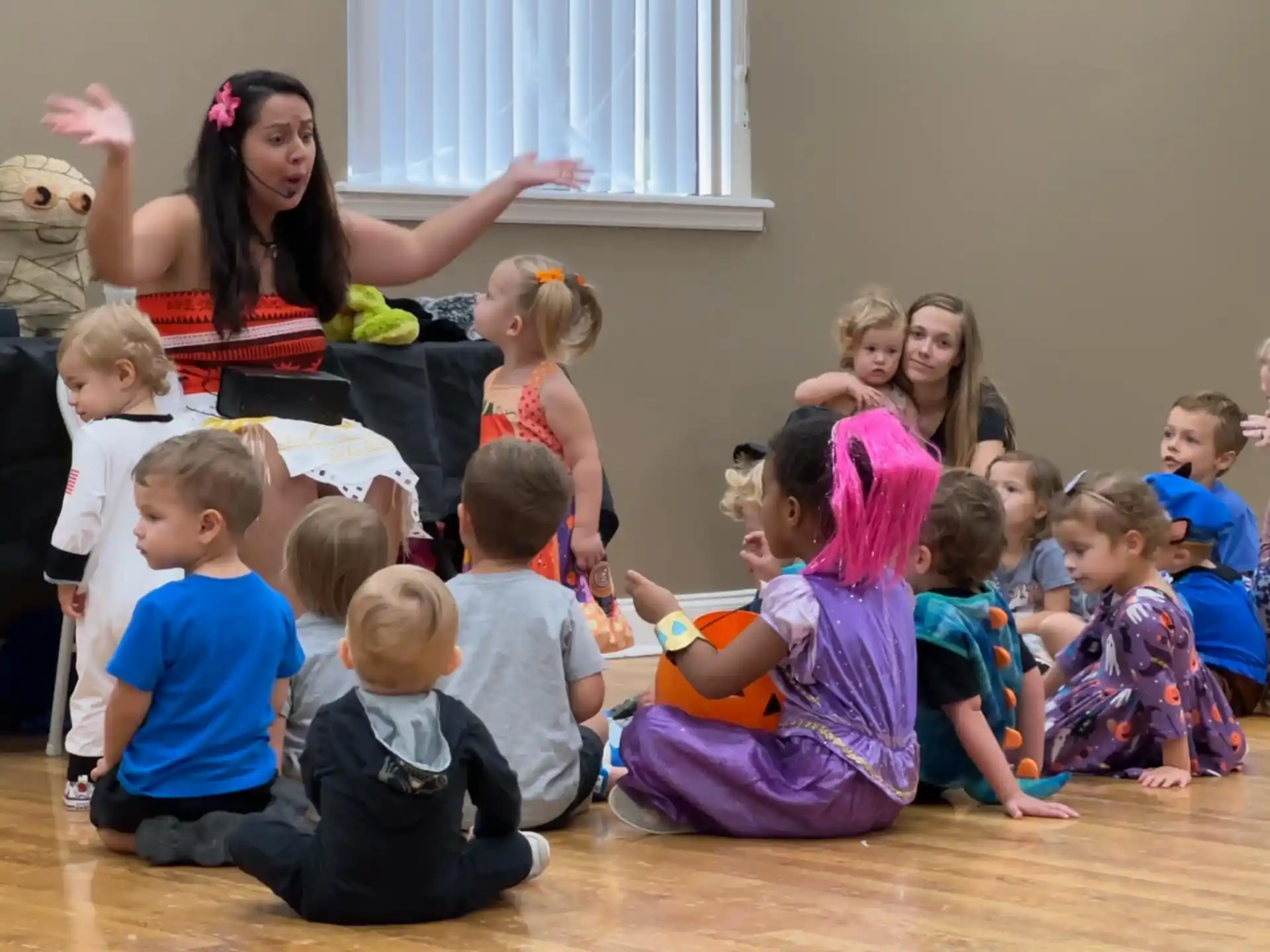 a group of children sitting on the floor