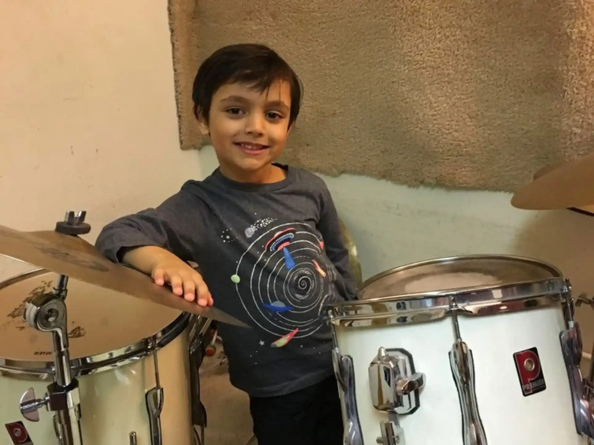 a boy playing drums